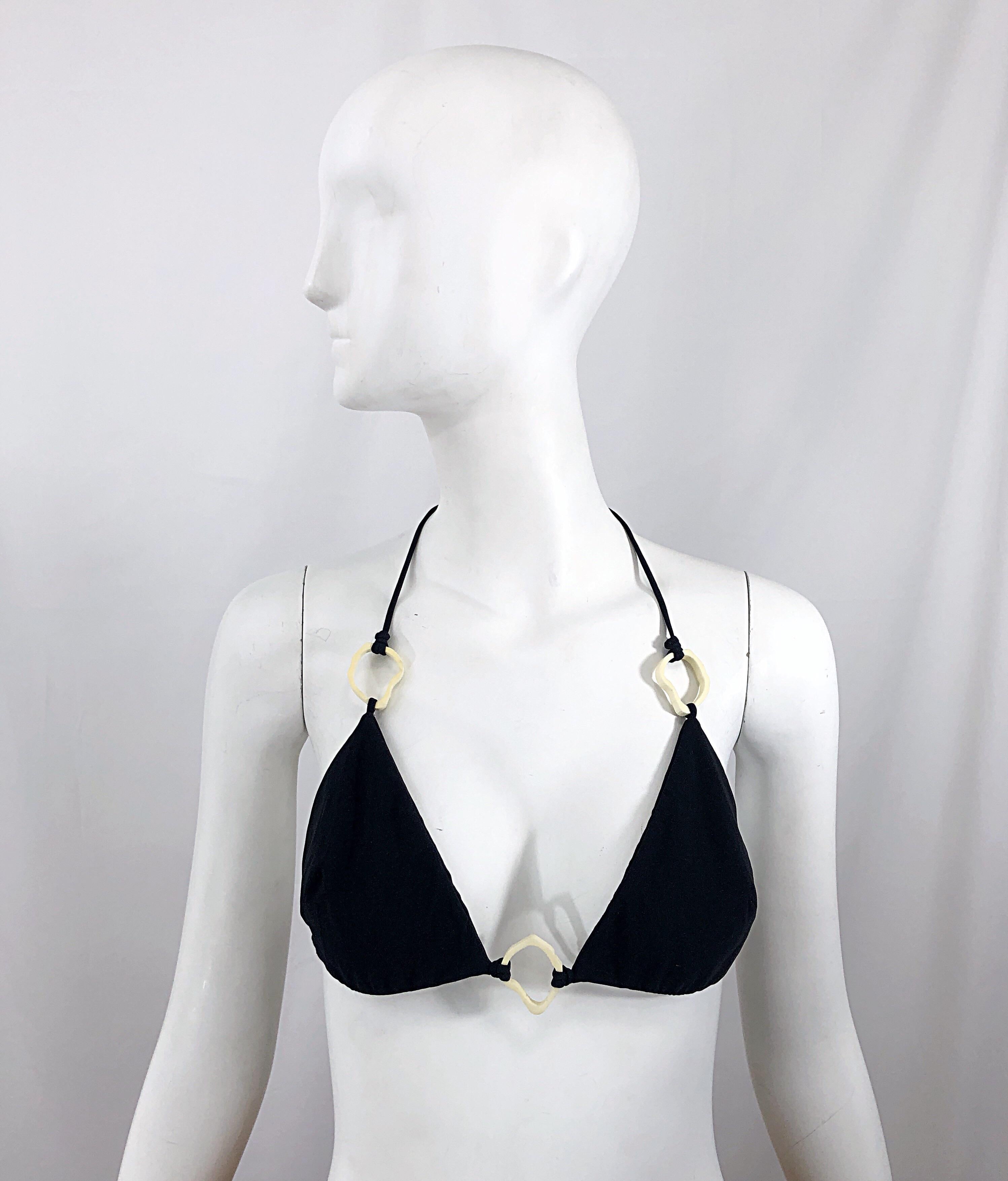 Brand new with tags YVES SAINT LAURENT by TOM FORD black halter sting bikini top! Features ivory plastic details that resemble pieces of coral. In great unworn condition.
Made in Italy
Marked Size Large
Measurements: (lots of stretch)
34-46 inch