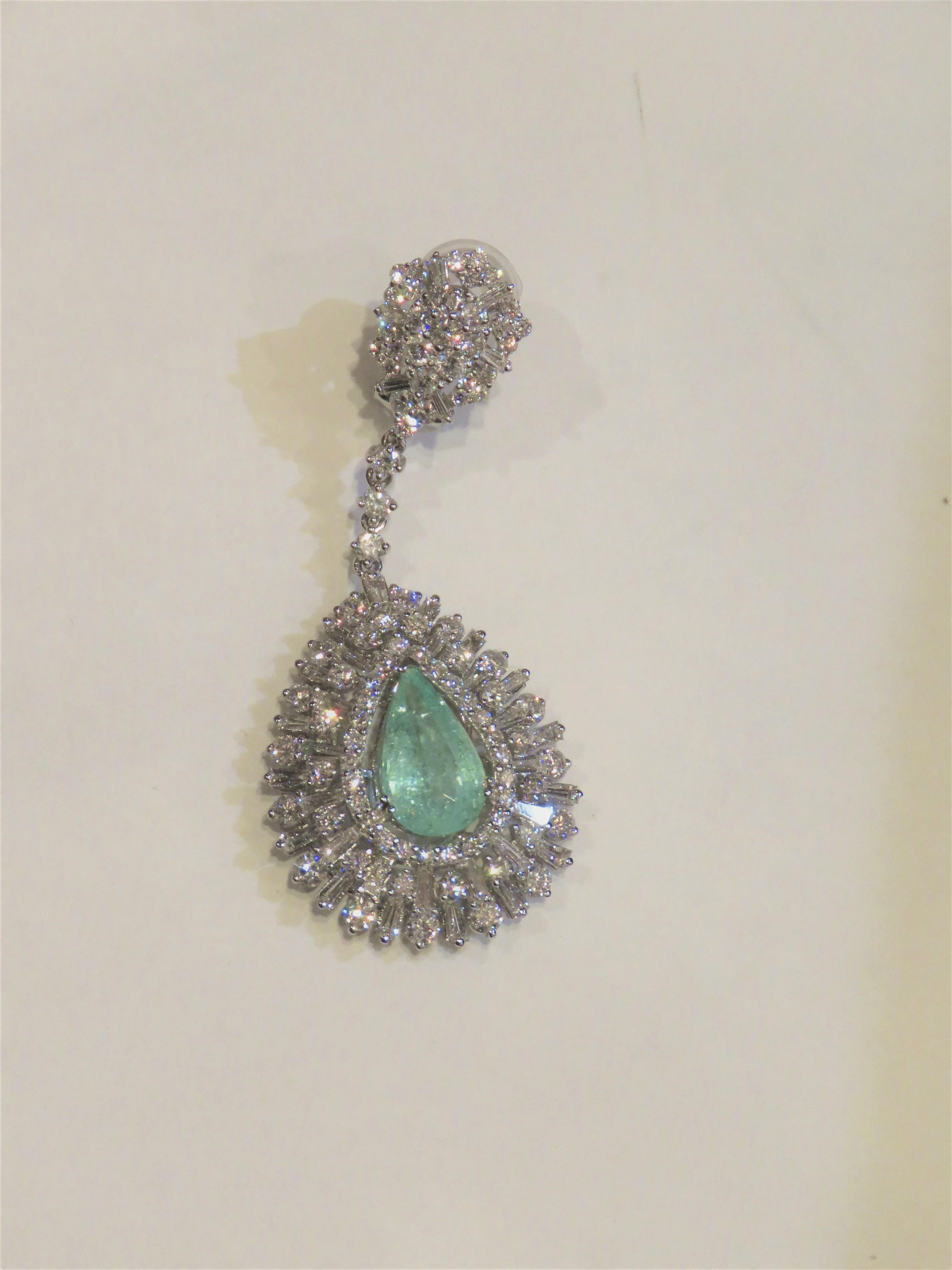 The Following Items we are offering is a Rare Important Spectacular and Brilliant 18KT Gold Large Gorgeous Fancy Large, Paraiba and Diamond Dangle Earrings. Earrings consists of Rare Fine Magnificent Paraibas surrounded and Framed with Gorgeous