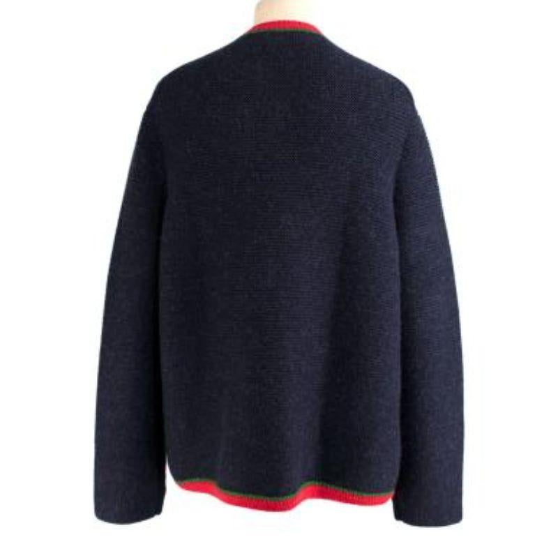 Gucci NY Yankees navy alpaca cardigan
 
 
 
 -Long cardigan framed by a red and green knit trim
 
 -The New York Yankees logo patch is on the front
 
 -Enameled GG buttons fastening along the front
 
 -Front pockets
 
 -Crew neck 
 
 -Heavy weight 
