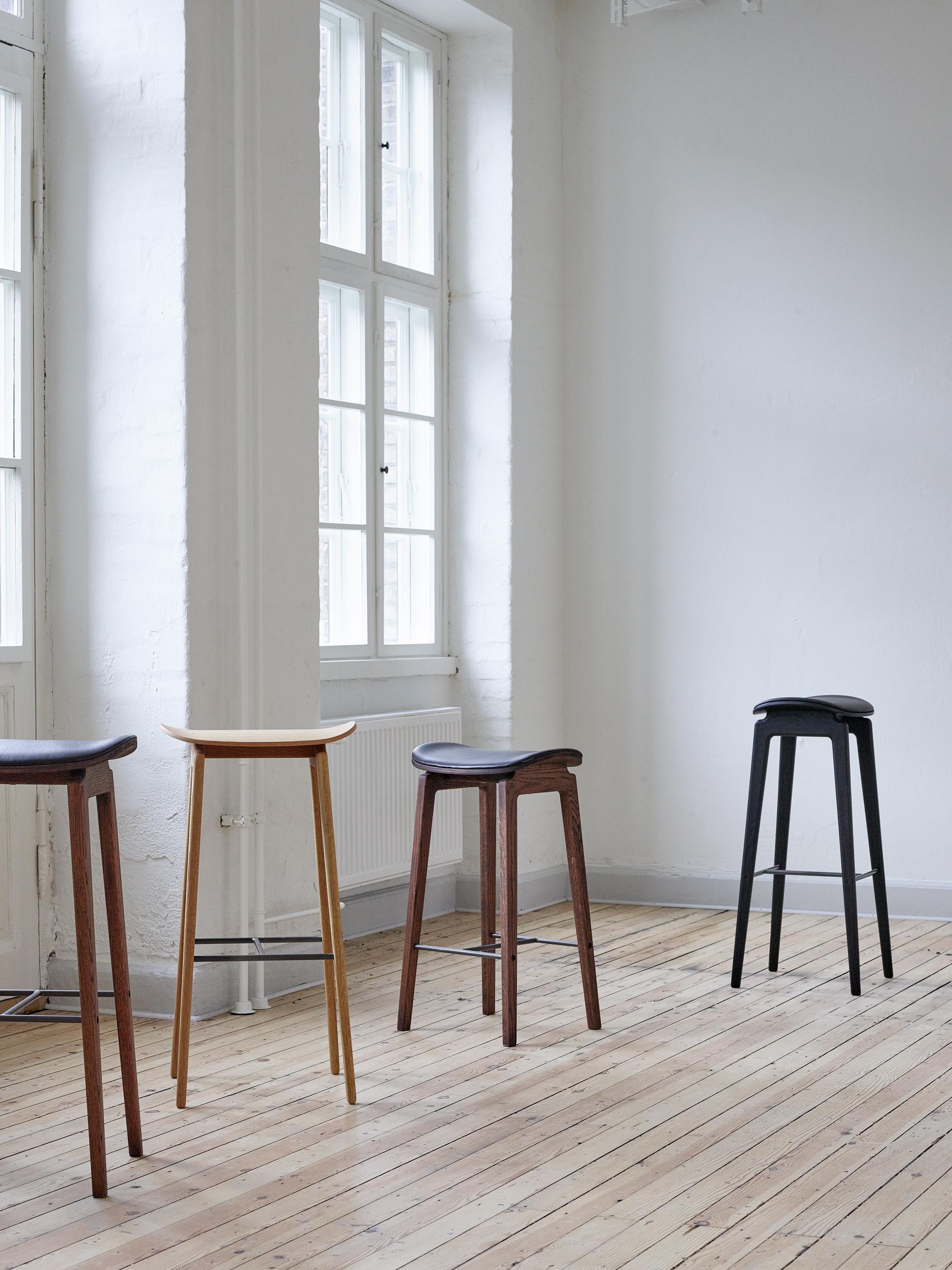 NY11 Bar Stool 65 by NORR11
Dimensions: D 30,5 x W 40,5 x H 65 cm.
Materials: Dark smoked oak and upholstery.
Upholstery: Dunes Camel 21004. 

Available in different oak finishes: Natural oak, light smoked oak, dark smoked oak, black oak. Also