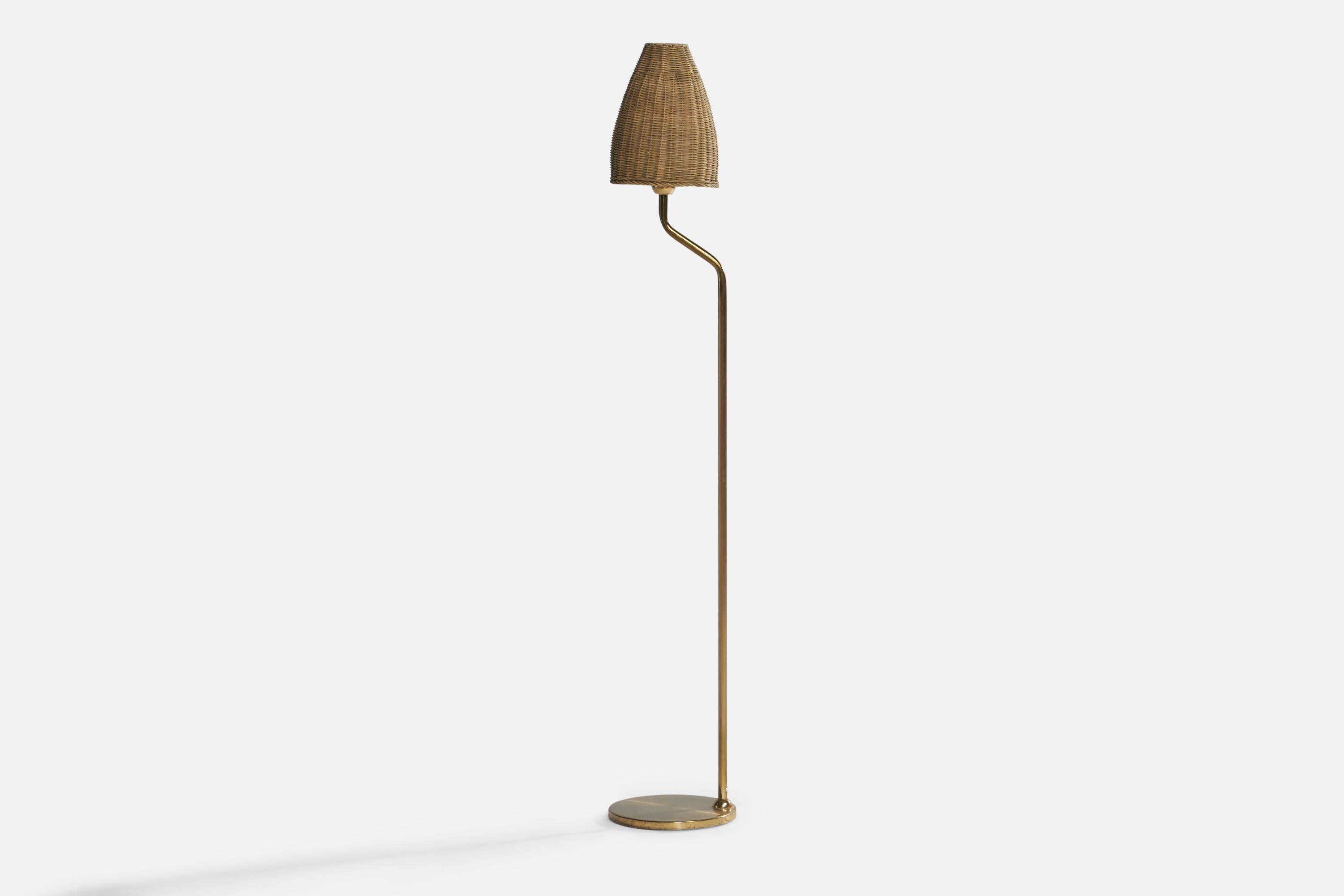 A brass and rattan floor lamp designed and produced by Nya Öia, Sweden, c. 1970s.

Overall Dimensions (inches): 51.75” H x 8.7” Diameter. Stated dimensions include shade.
Bulb Specifications: E-26 Bulb
Number of Sockets: 1
All lighting will be