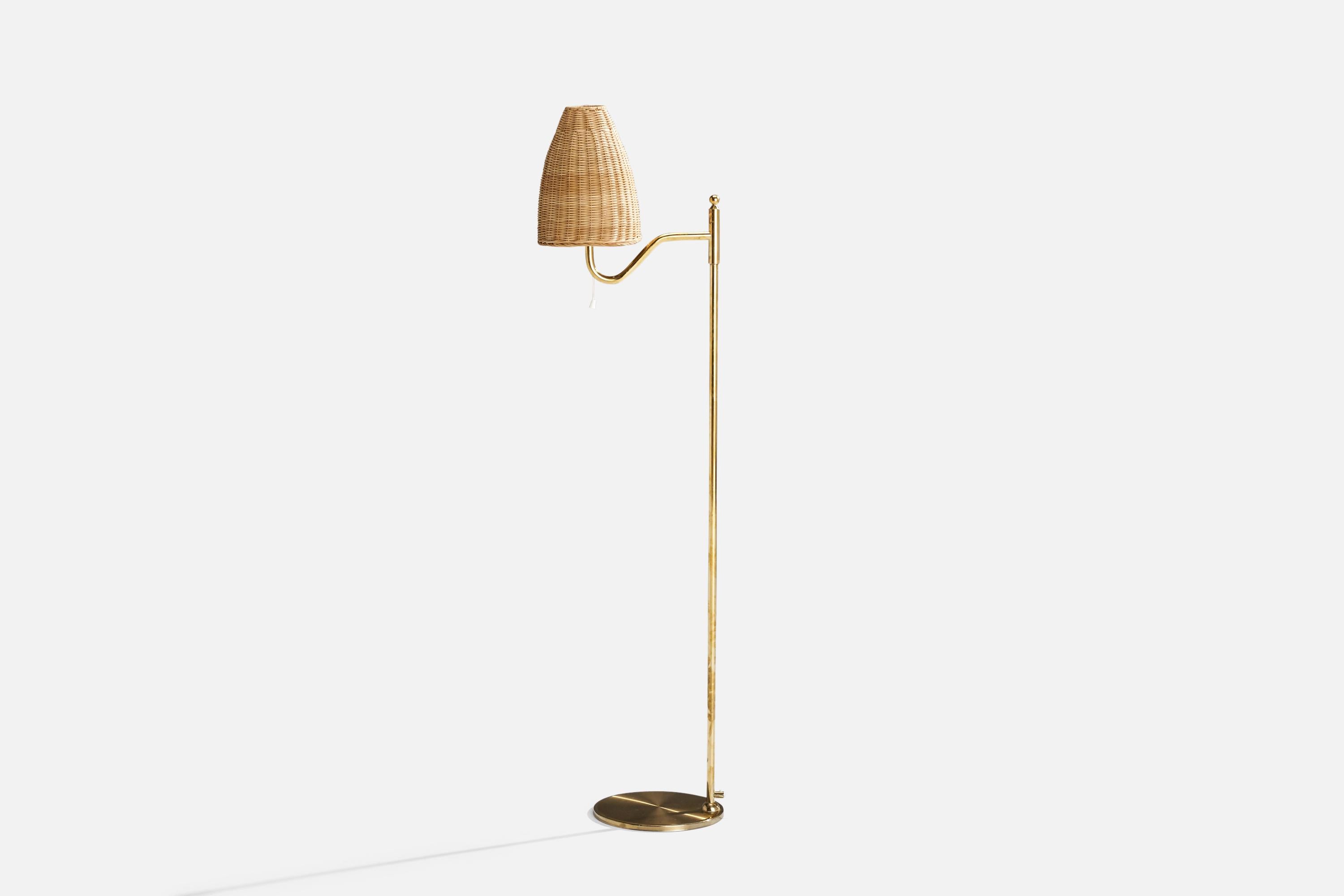 A brass and rattan floor lamp designed and produced by Nya Öia, Sweden, 1970s.

Overall Dimensions (inches): 51.75” H x 7.5” W x 15.875” D
Stated dimensions include shade.
Bulb Specifications: E-26 Bulb
Number of Sockets: 1
All lighting will be