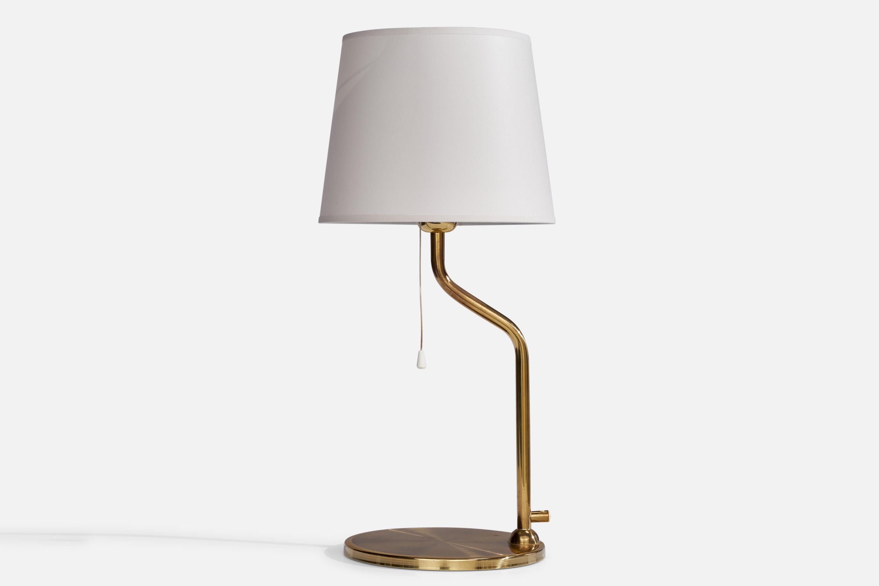 A brass table lamp designed and produced by Nya Öia, Sweden, 1960s.

Dimensions of Lamp (inches): 15.75” H x 8.75” Diameter
Dimensions of Shade (inches): 8” Top Diameter x 10” Bottom Diameter x 8” H
Dimensions of Lamp with Shade (inches): 22.2” H x