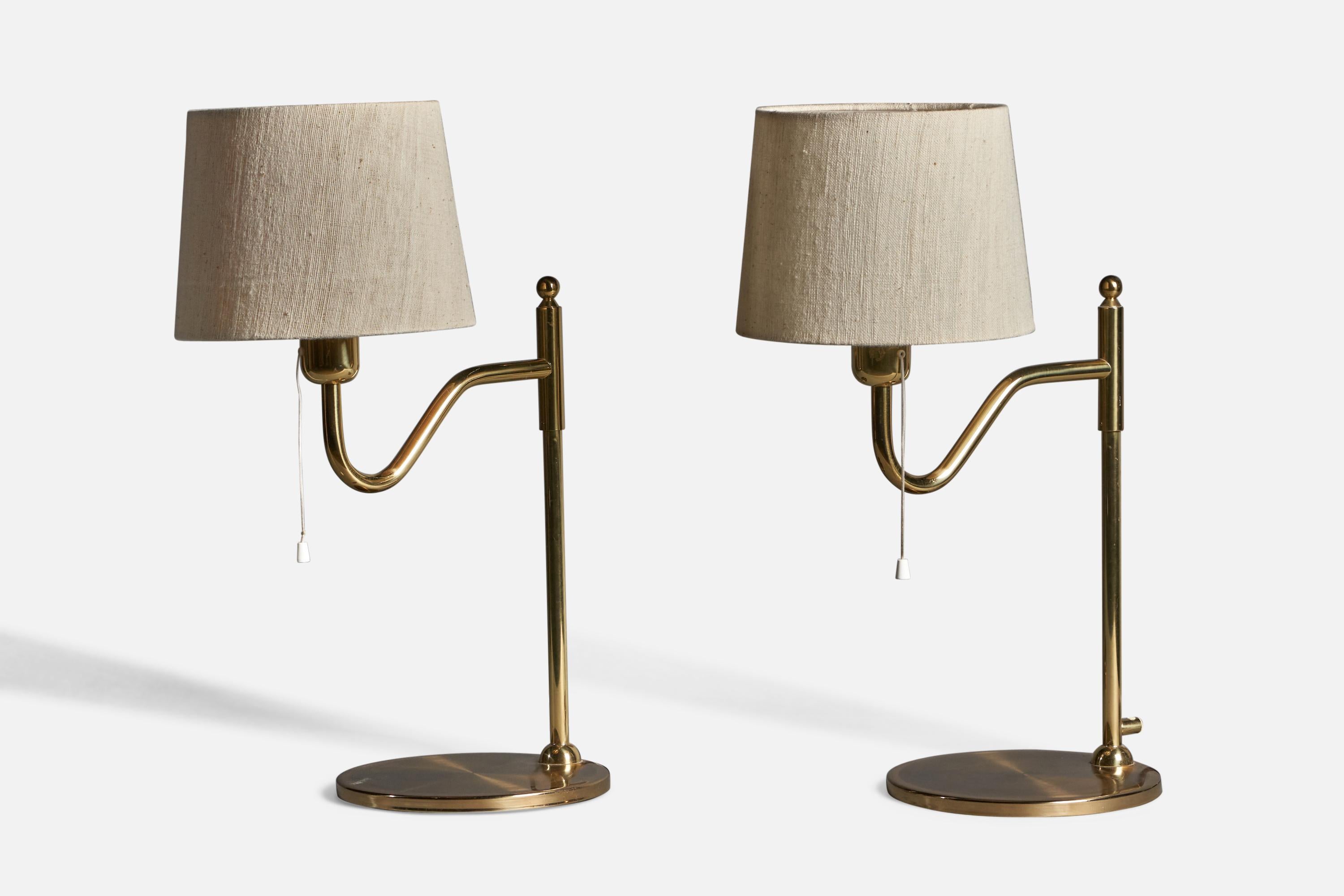 A pair of brass and light beige fabric table lamps, designed and produced by Nya Öia, Sweden, 1970s.

Overall Dimensions (inches): 21.5