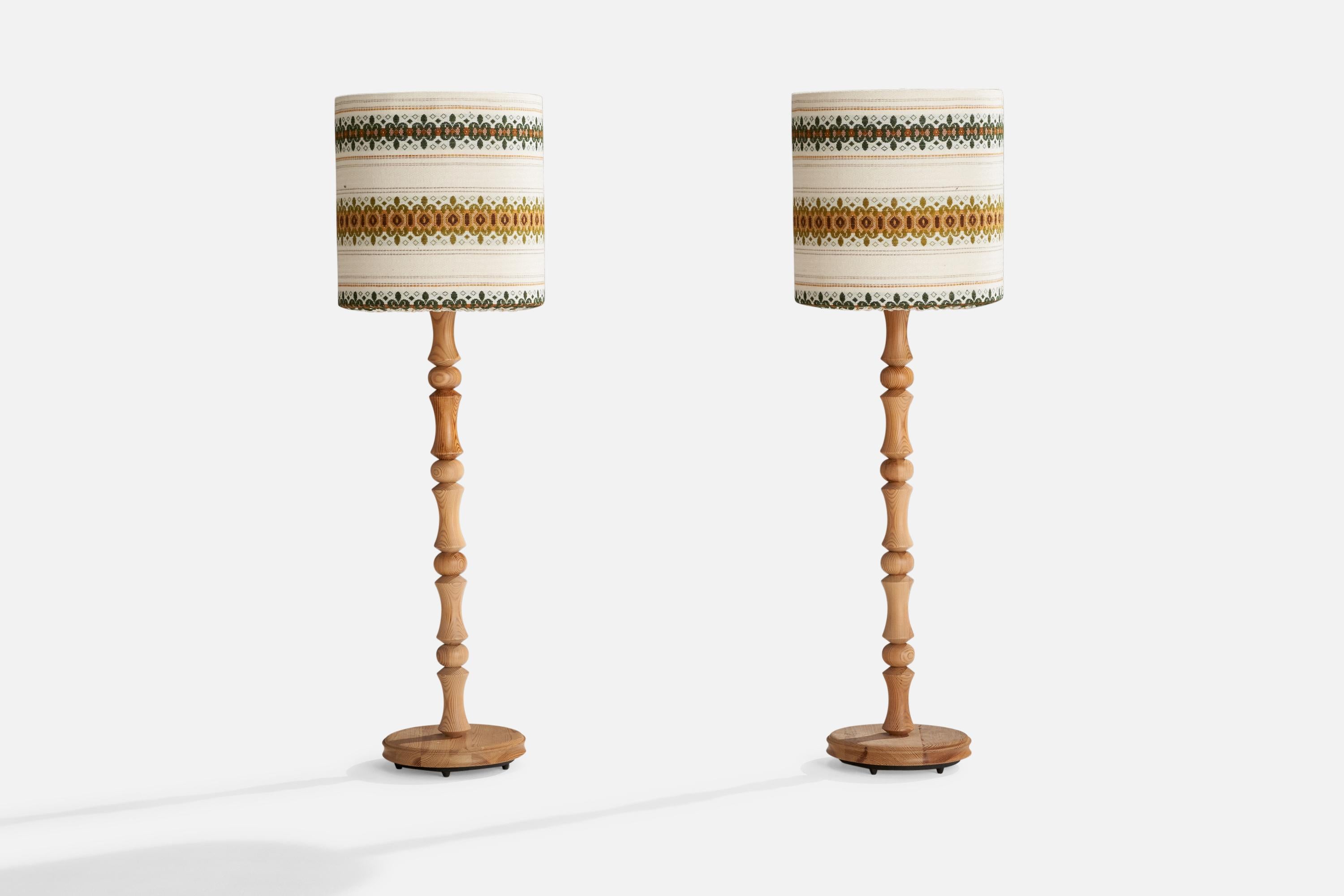 A pair of small pine and woven off-white, yellow and green fabric floor lamps designed and produced in Sweden, 1970s.﻿

Overall Dimensions (inches):46” H x 13.625” W x16.5” D
Stated dimensions include shade.
Bulb Specifications: E-26 Bulb
Number of