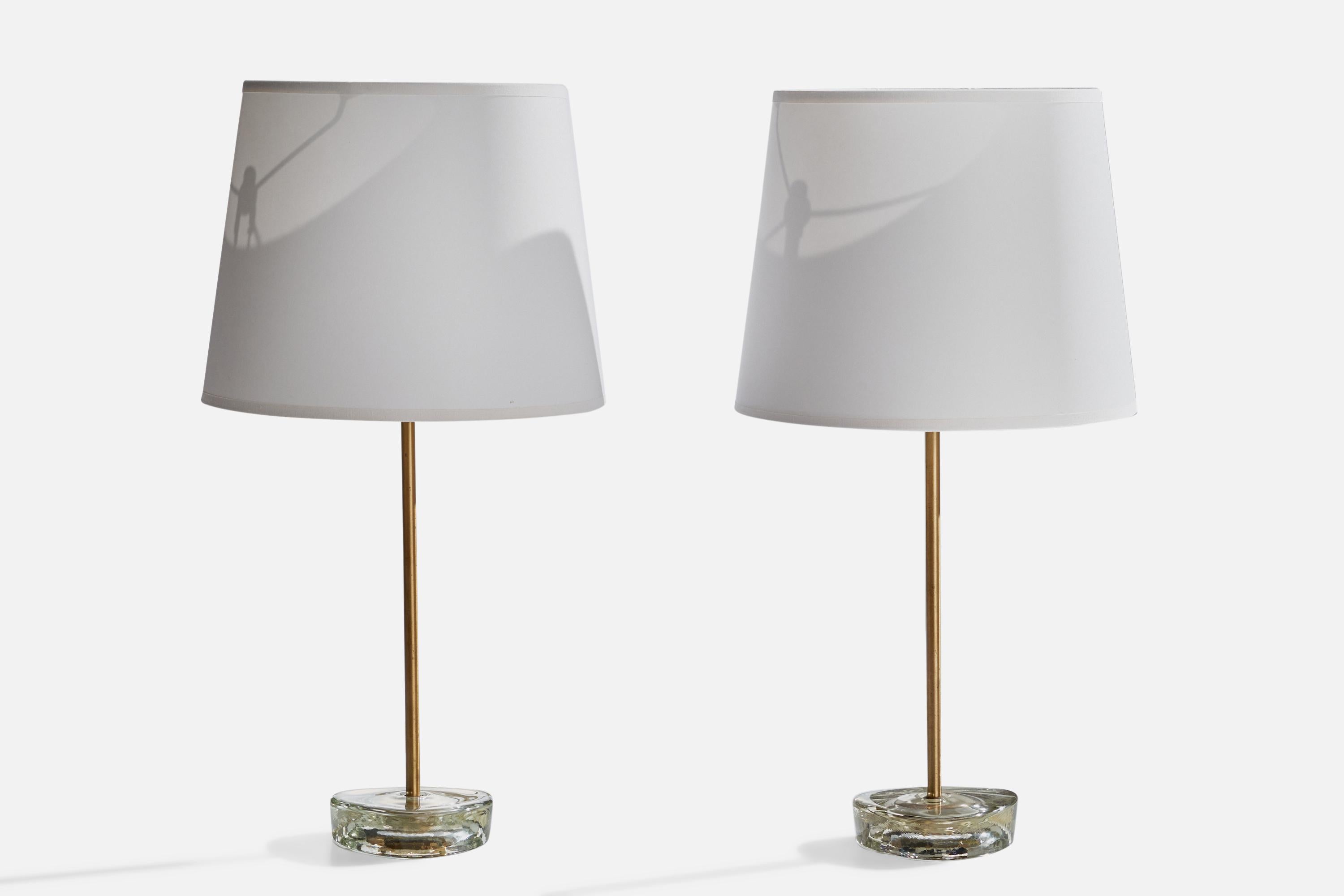 A pair of brass and glass table lamps designed and produced by ANF Nybro Armaturfabrik, Sweden, c. 1960s.

Dimensions of Lamp (inches): 13.5” H x 4.25”  Diameter
Dimensions of Shade (inches): 7.75” Top Diameter x 10”  Bottom Diameter x 8”