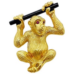 NYC 18 Karat Yellow Gold Monkey Brooch with Onyx and Ruby