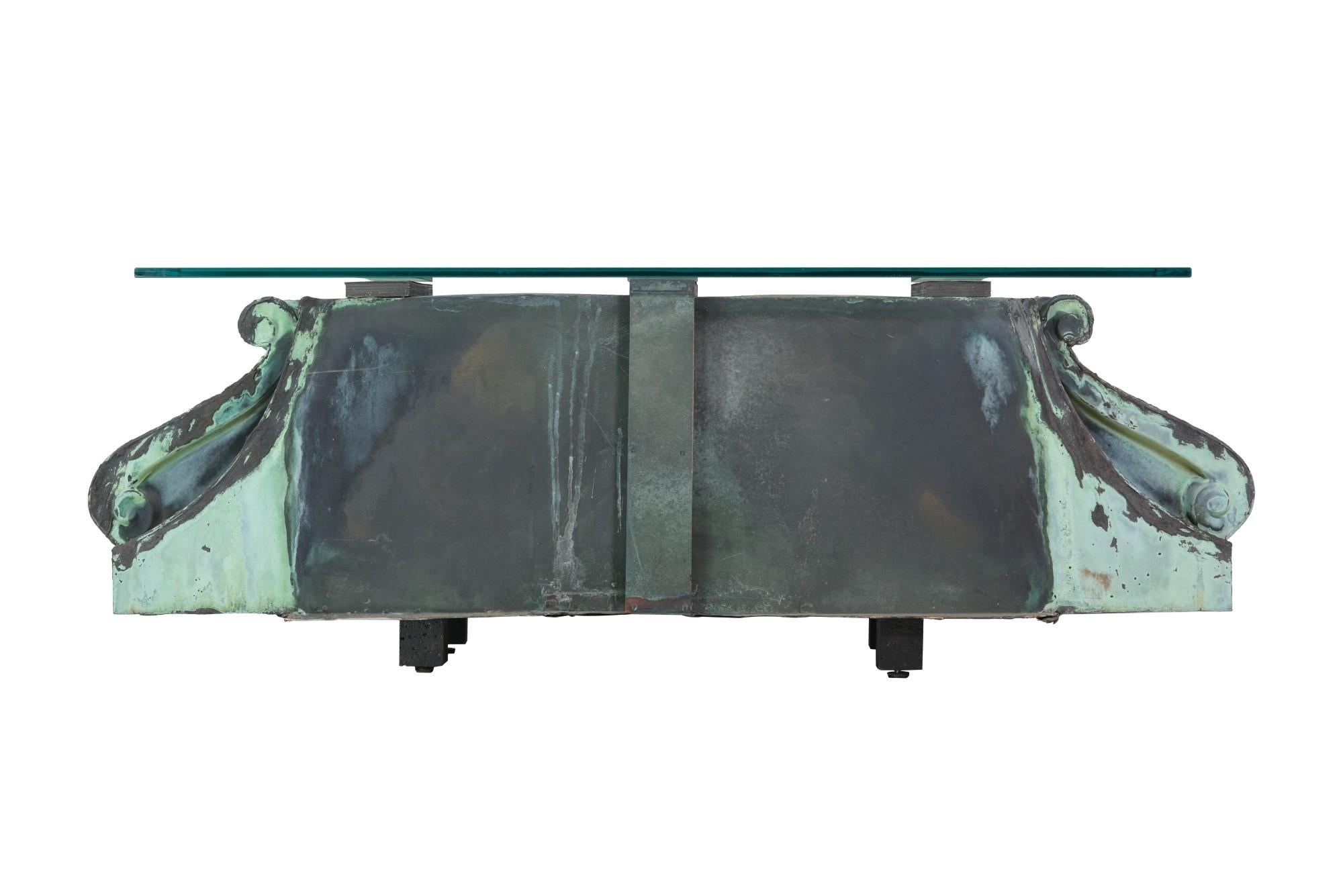 Pair of early 20th century copper corbel featuring their original verdigris from a New York City building mounted on wood and mated with a glass top. Different size tops available. Please note, this item is located in our Los Angeles location.