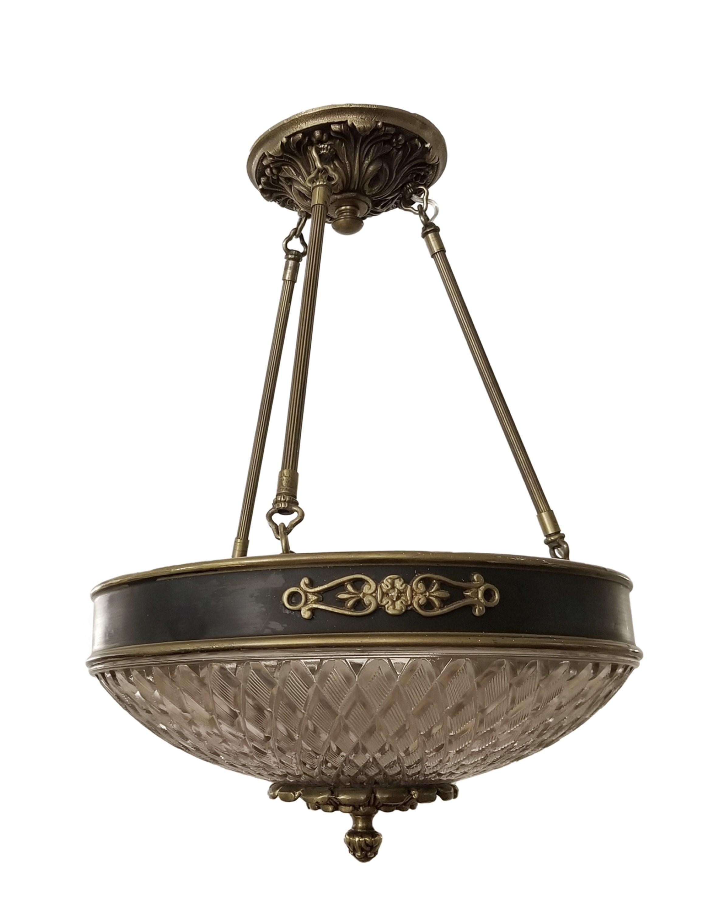 20th Century Empire style chandelier pendant with cast glass dish and bronze details. These elegant lights graced many of the main corridors of the NYC Waldorf Astoria Hotel. A Waldorf authenticity card is included in your purchase. Small quantity