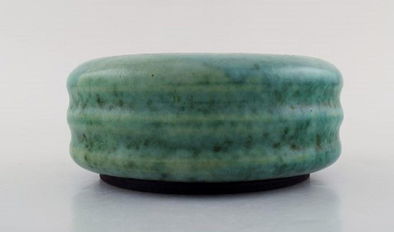 Nylund & Krebs for Saxbo. Early and rare Art Deco jar in a grooved design. Beautiful glaze in turquoise shades. Dated 1929-1930.
Measures: 17 x 7 cm.
In very good condition.
Stamped.