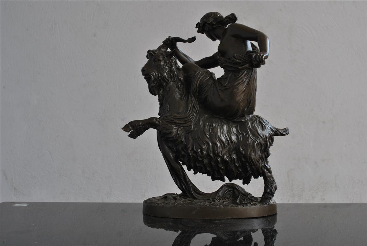Nymph on a goat bronze sculpture with brown patina signed Clodion (1738-1814).