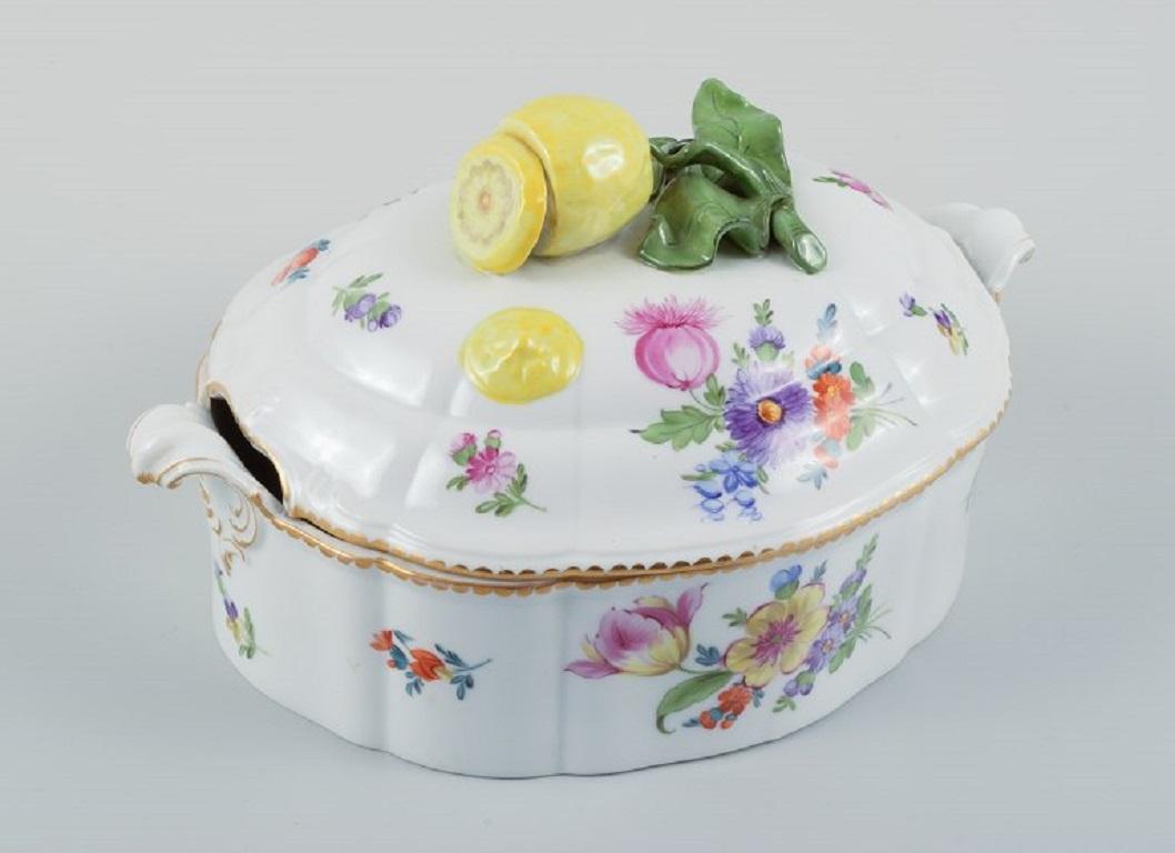 Nymphenburg, Germany. Hand-painted porcelain lidded tureen with polychrome flowers, lid knob in the shape of a lemon.
Approx. 1930s.
In excelent condition.
Marked Nymphenburg.
Measurements: L (including handle) 27.0 cm. x H 16.0 cm.