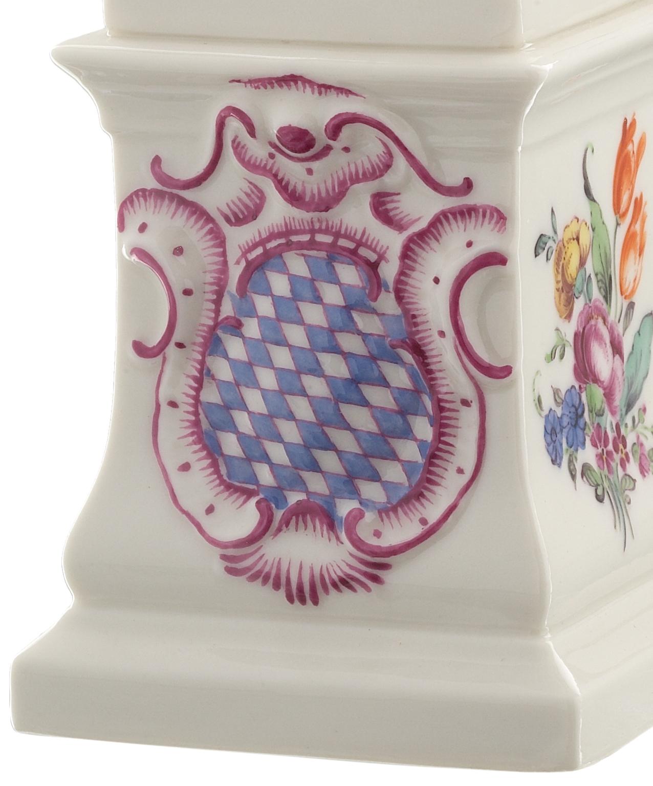 This allegorical cherub Luna holding the cycle moon is handcrafted in Nymphenburg porcelain. The figure stands on a pedestal adorned with the Bavarian crest and floral bouquets. The perfect addition to any table decoration. 