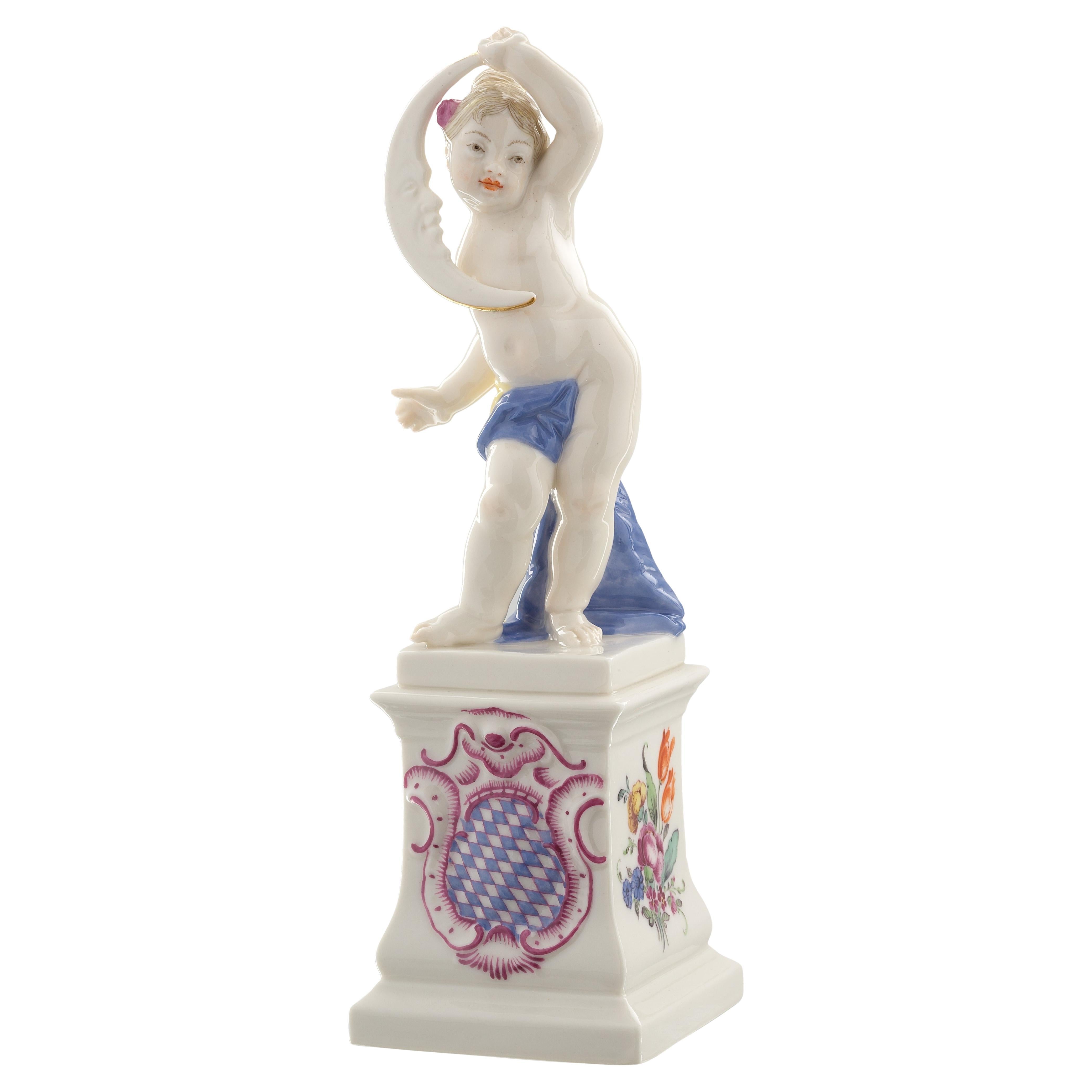 Nymphenburg Porcelain handcrafted and hand painted cherub on a pedestal