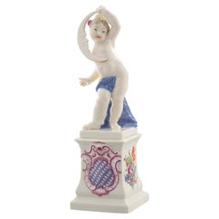 Nymphenburg Porcelain handcrafted and hand painted cherub on a pedestal