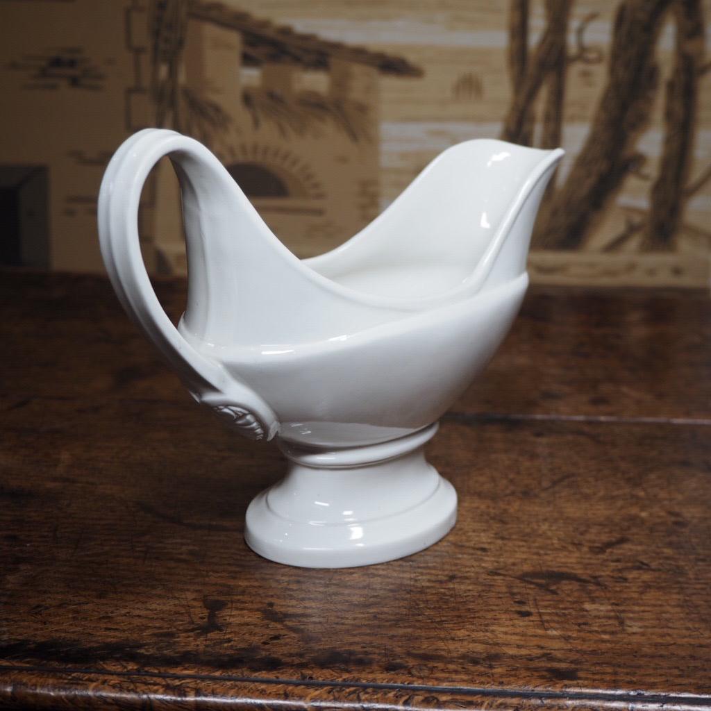 Nymphenburg sauceboat of elegant neo-classical boat form, the handle with an anthemion mounded at the lower junction, on an oval plinth base. Impressed shield & ‘Leg’ mark, Circa 1850


Provenance: The Antique Porcelain Company, NY ref. Ziffer