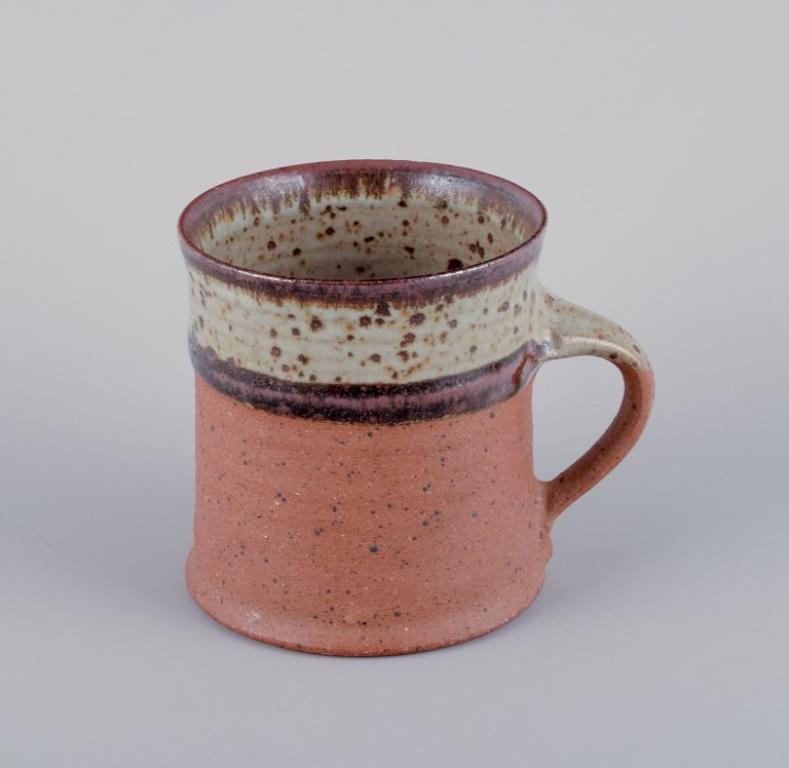 Scandinavian Modern Nysted Ceramics, Denmark. Three ceramic cups in brown shades. For Sale