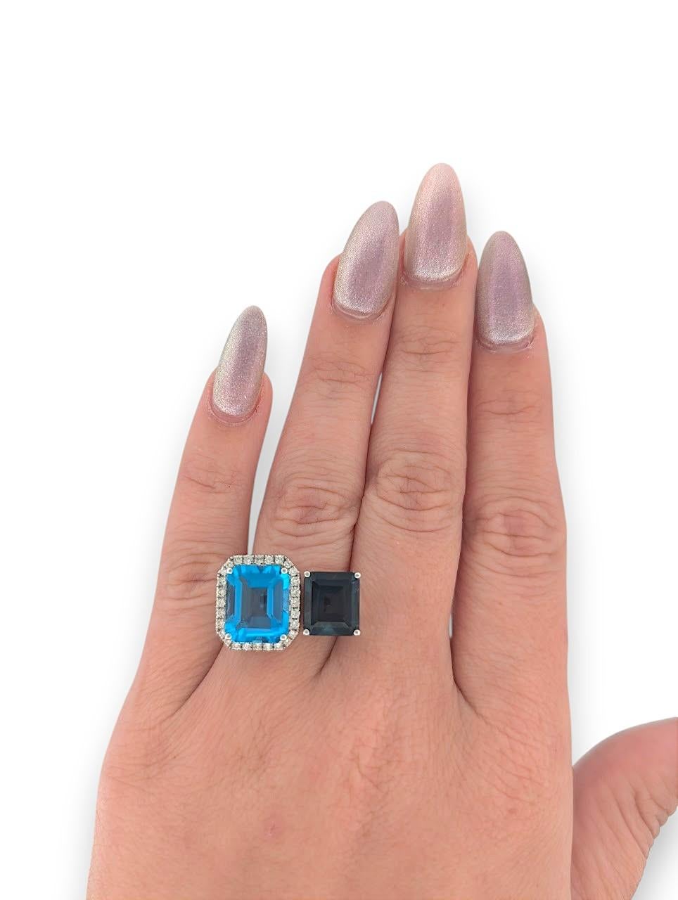 Discover Nyx, an elegant ring designed for those who crave bold elegance and timeless beauty. Featuring a stunning 12.30‑carat natural blue topaz centerpiece in rich, ocean-blue hues, this ring offers an eye-catching presence. Complemented by .37 ct