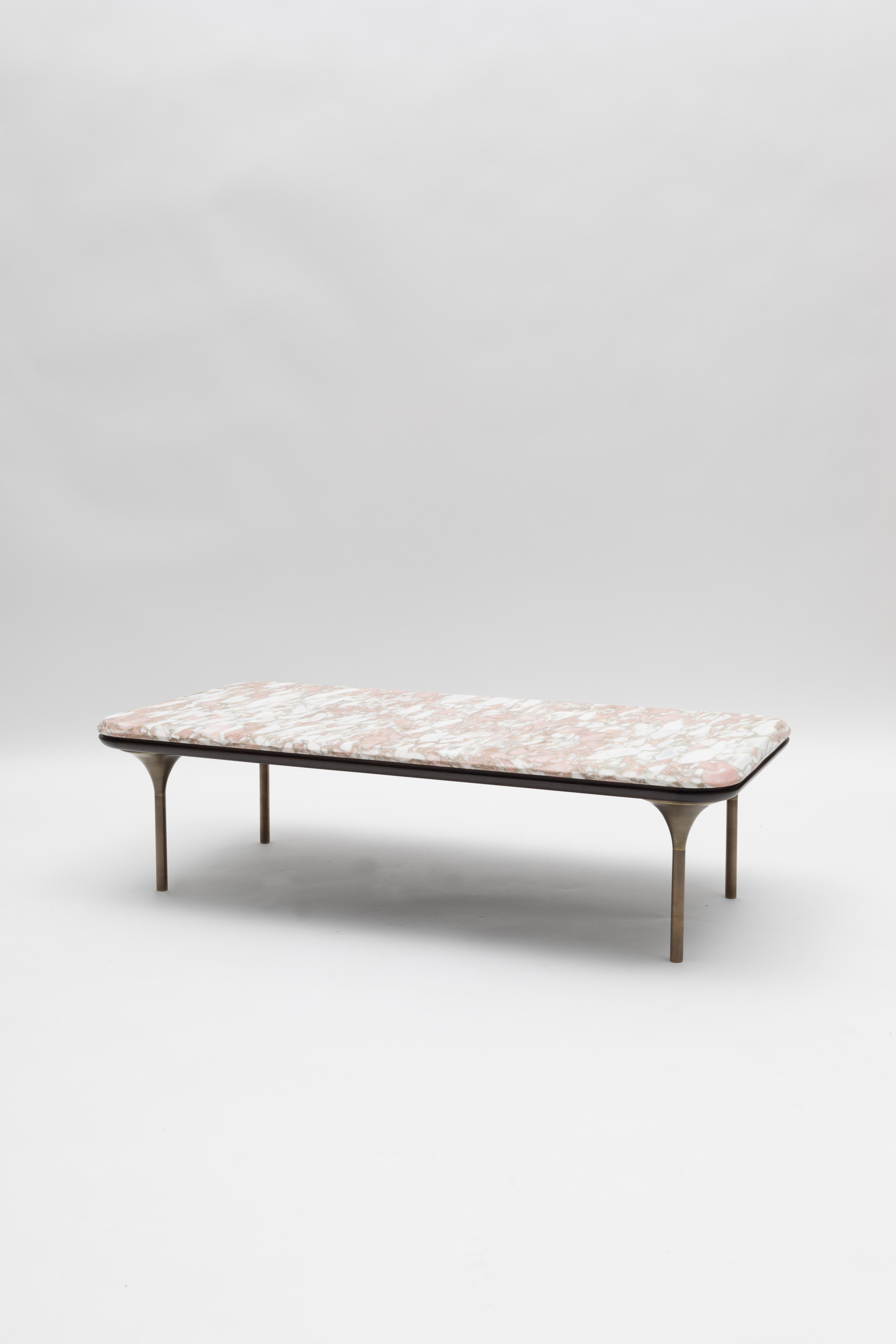 The NYX table's rounded and delicate profiles are meticulously handcrafted in premium materials. Slender curvilinear lines define a timeless, sophisticated and sexy piece. 

The juxtaposition and layering of refined materials such as: Lilac marble,