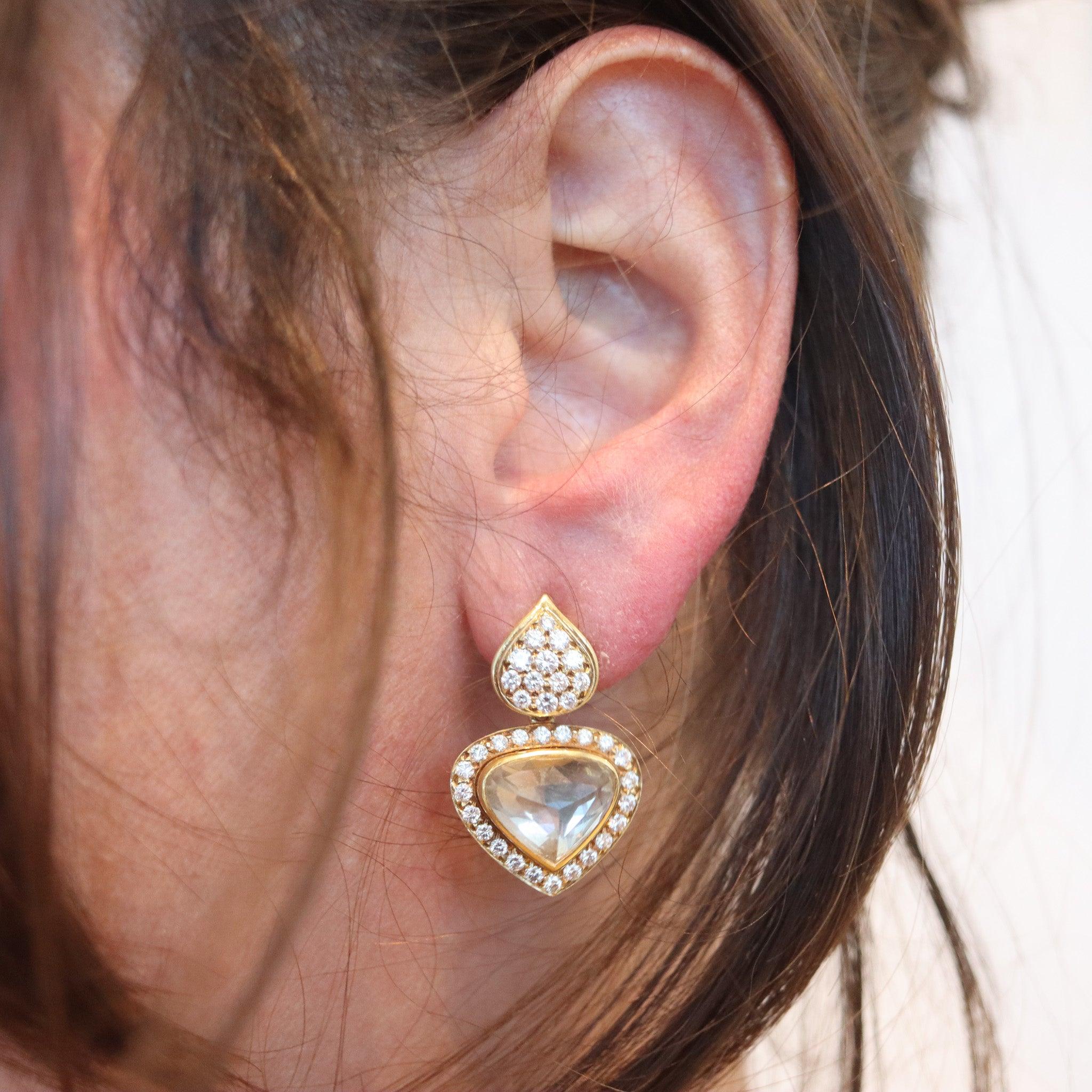 Diamonds hearts clips-on earrings designed by O. J. Perrin Joaillier.

This is a beautiful pair of dangle drops clips-on earrings created in Paris France by the jewelry house of O. J. Perrin, back in the 1980. The earrings were carefully crafted