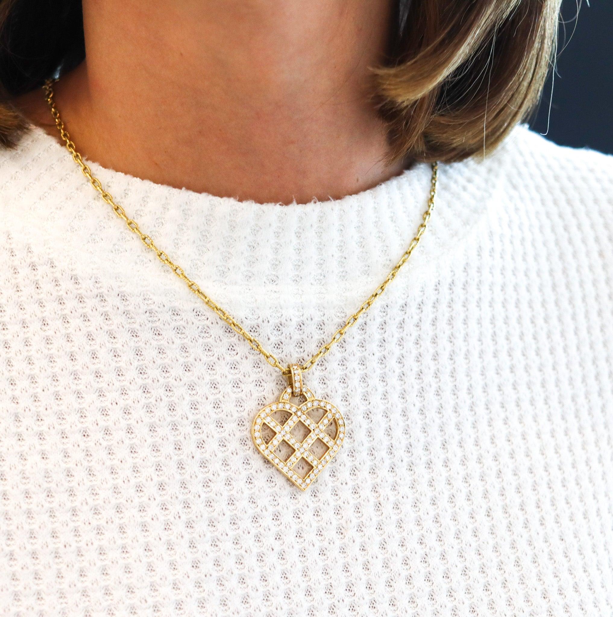 Diamonds heart pendant designed by O. J. Perrin.

This is a modernist heart shaped pendant, created in Paris France by the jewelry house of O. J. Perrin, back in the 1980. The beautiful heart was carefully crafted with sleek squared patterns in