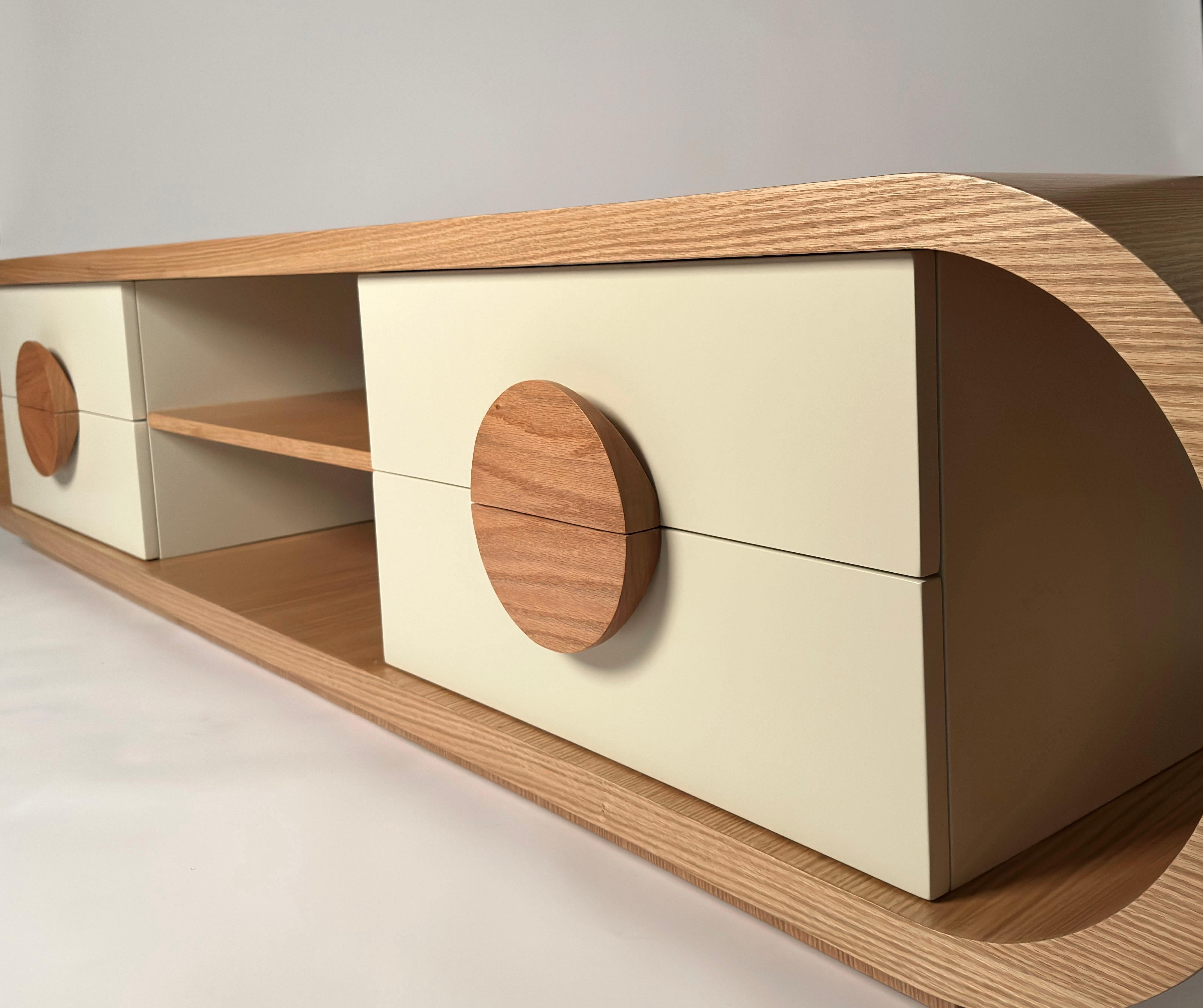 An adaptation of the O-line with soft curves and bold functions. Shown here in natural oak wood with Ivory painted drawers. This piece is customizable in different finishes,colors  and size. 
The O line celebrates the skills of Egyptian artisans and