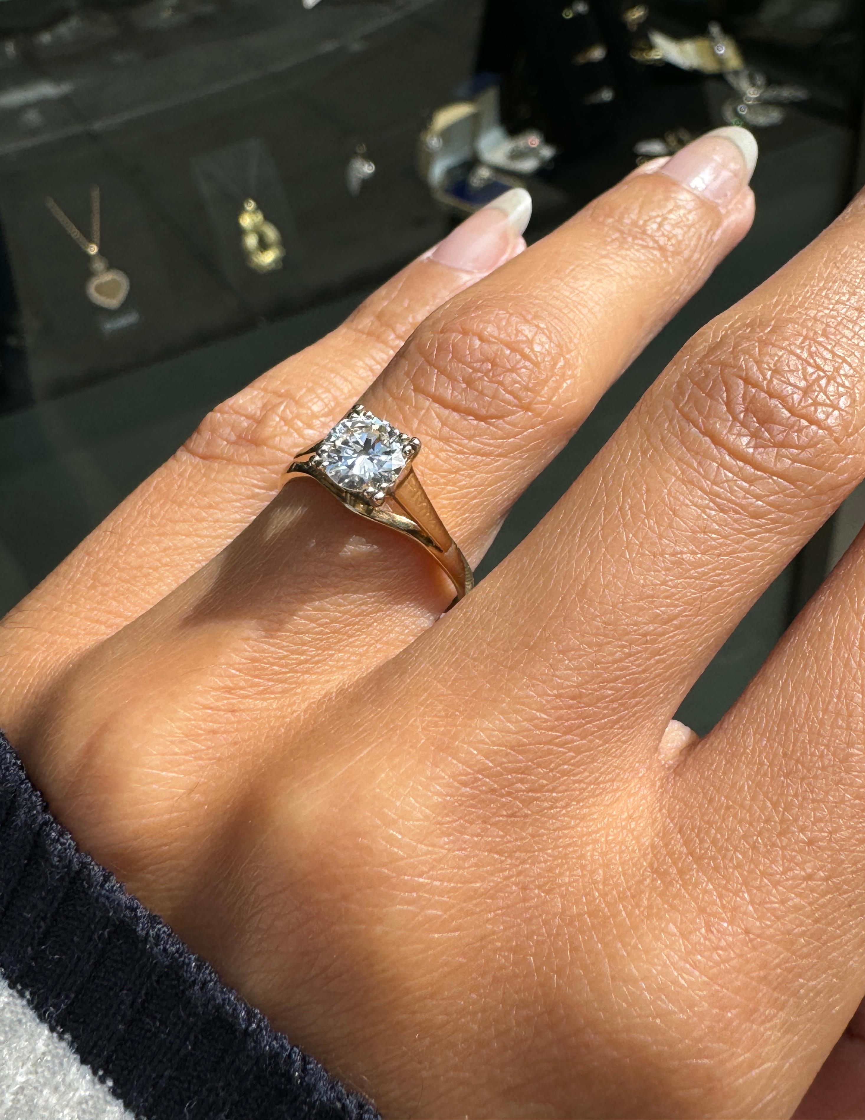 Brilliant Cut O.69 Carat Diamond and 18 Carat Yellow and White Gold Solitaire Engagement Ring For Sale