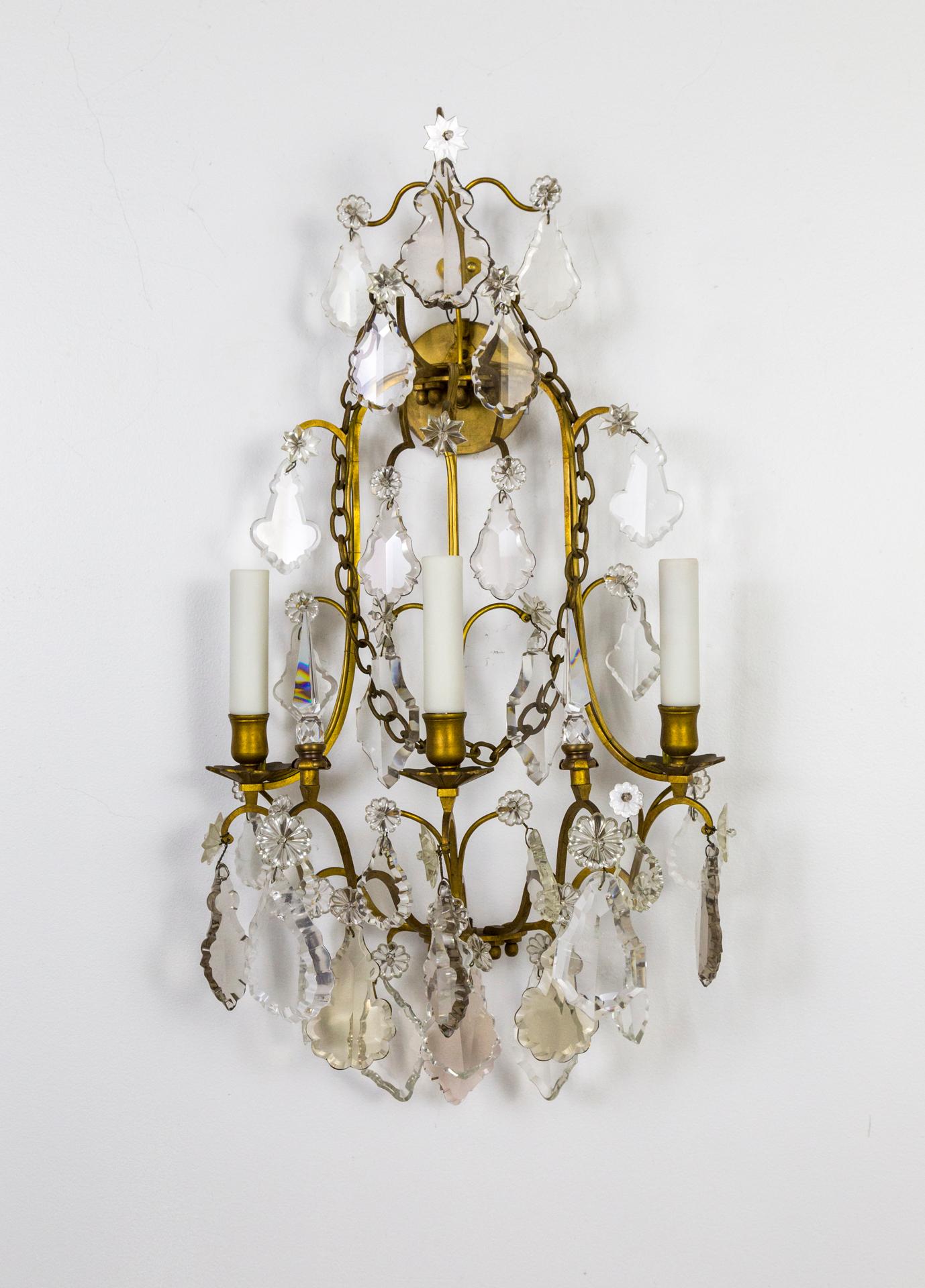 Beautiful delicate, but with large crystals and rock crystal decorations, pair of 3 light, French gilt bronze wall
sconces. Unique chain neckless detailing. Belle Époque, of the Period. Newly wired. 