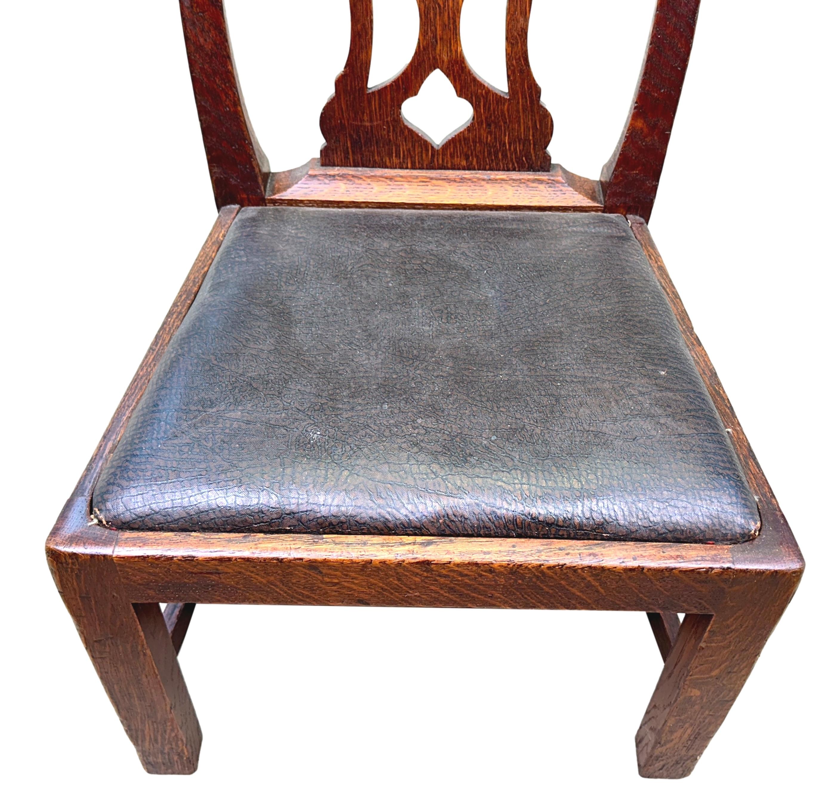A Very Attractive Late 19th Century Oak Childs Chair, Of Hepplewhite Style, Having Attractive Shaped And Pierced Splat Back, Over Faux Leather Drop In Seat, Raised On Square Legs And Stretchers.

Childrens, or Childs Chairs as the name suggests were