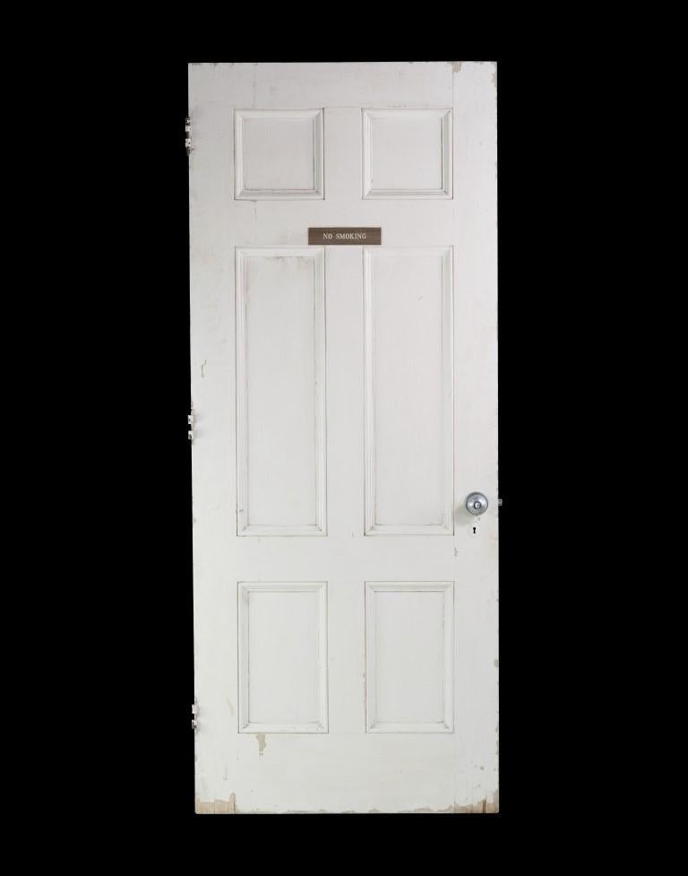 20th Century oak six panel door with white paint on one side and a natural dark stain on the other side. Original nickel finish door hardware. This can be seen at our 400 Gilligan St location in Scranton, PA. Measures: 83 x 34.