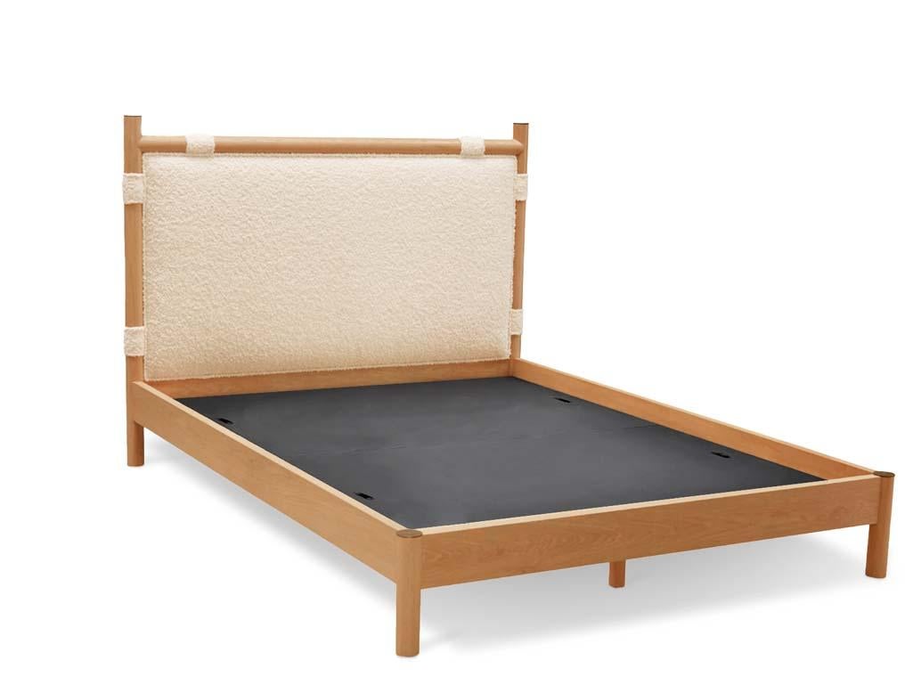 The Chiselhurst bed is an upholstered bed with a solid American Walnut or White Oak frame finished with brass caps. Slats are provided. Available with or without footboard. Shown here in Oiled Oak and Alpaca Bouclé. 

The Lawson-Fenning Collection