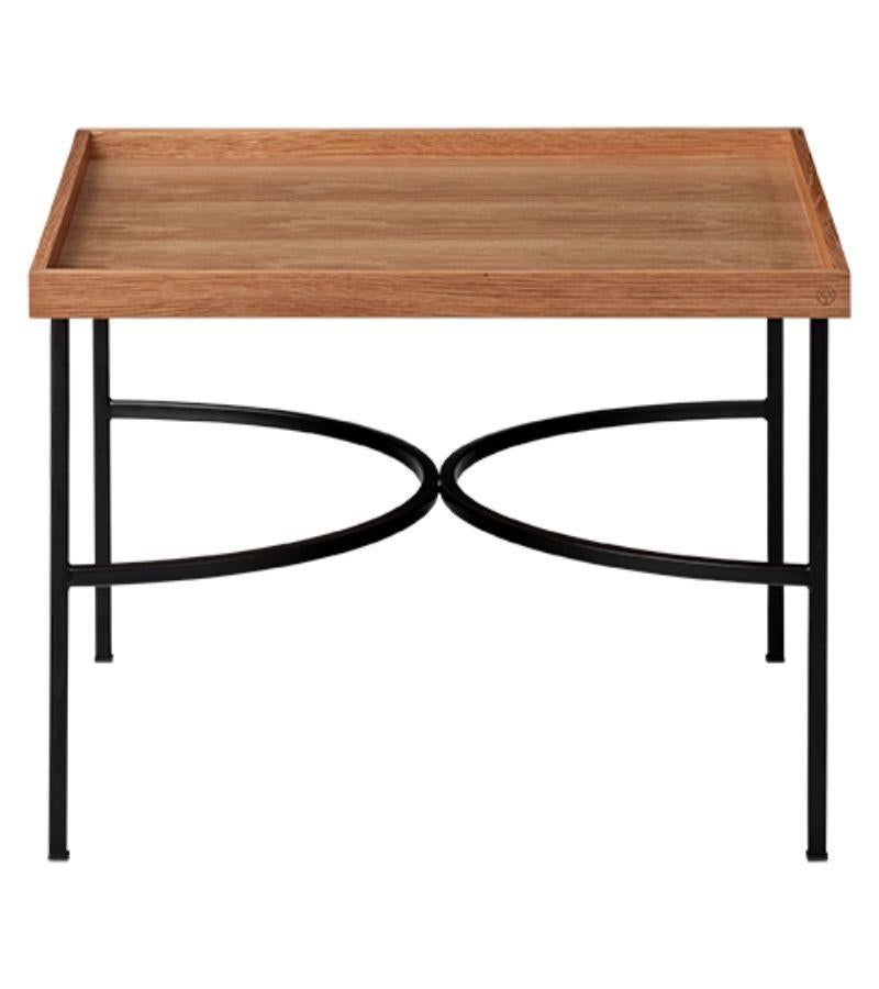 Oak and black contemporary tray table
Dimensions: D 52.5 x W 52.5 x H 38 cm 
Materials: Natural oak, iron with powder coating, or iron with brass plating.
Available in black, oak, walnut, and black or gold powder-coated base.


Impeccable