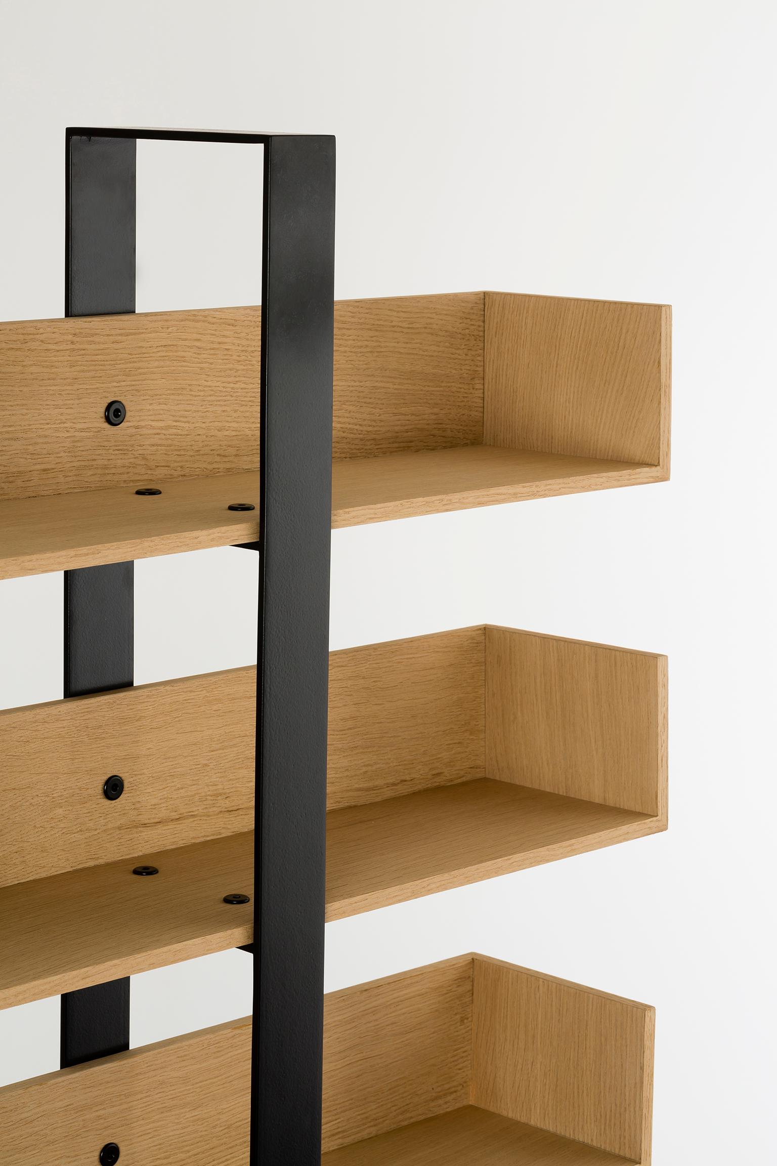 Shelves veneered with real wood and assembled by hand, frame in CRS steel, hand welded and polished, the Severing Bookshelf stands out with its high end materials and fine crafting. Its compact size allows it to fit anywhere, while its seven