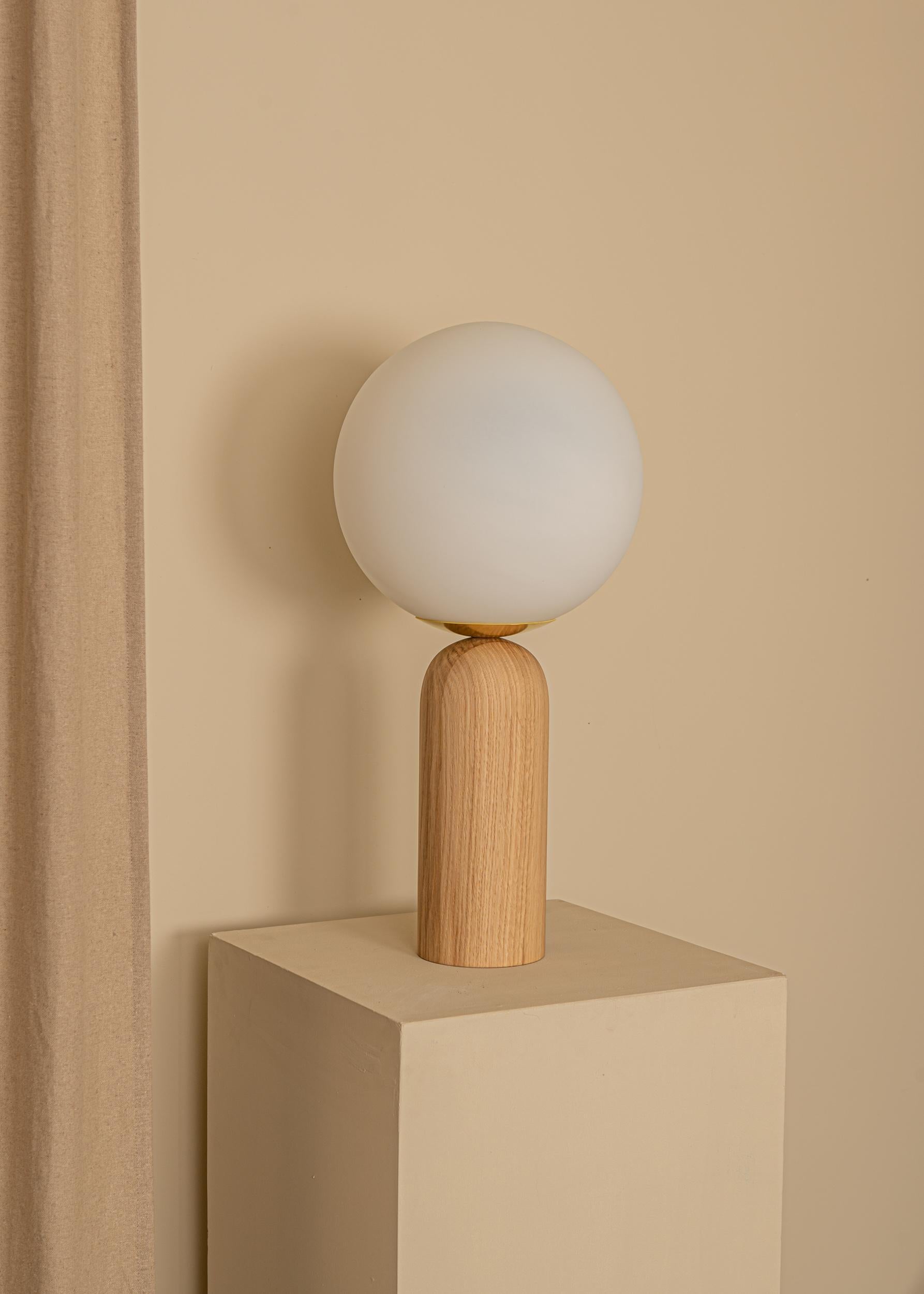 Oak and Brass Atlas Table Lamp by Simone & Marcel
Dimensions: Ø 30 x H 60 cm.
Materials: Glass, brass and oak.

Also available in different marble, wood and alabaster options and finishes. Custom options available on request. Please contact us.