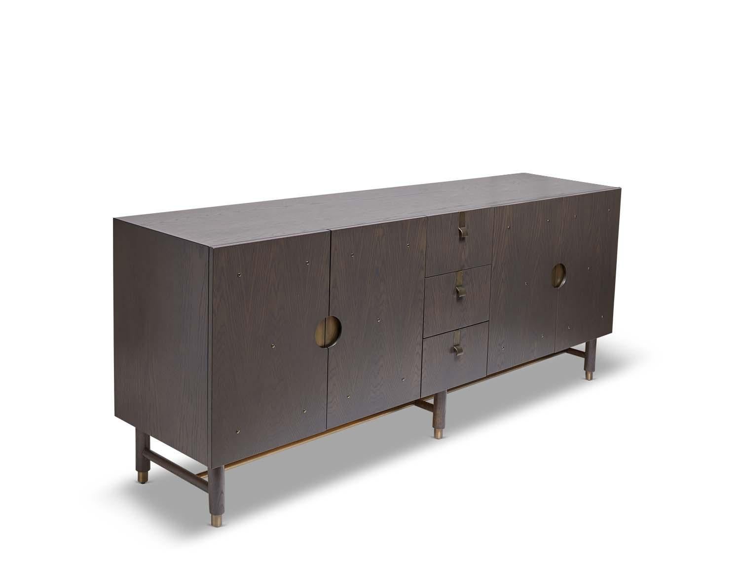 The Niguel cabinet by Lawson-Fenning has a brass stretcher on the base, brass inlaid details on the doors and insert brass handles. The interior is lacquered. Shown here in dark grey washed oak.

The Lawson-Fenning Collection is designed and