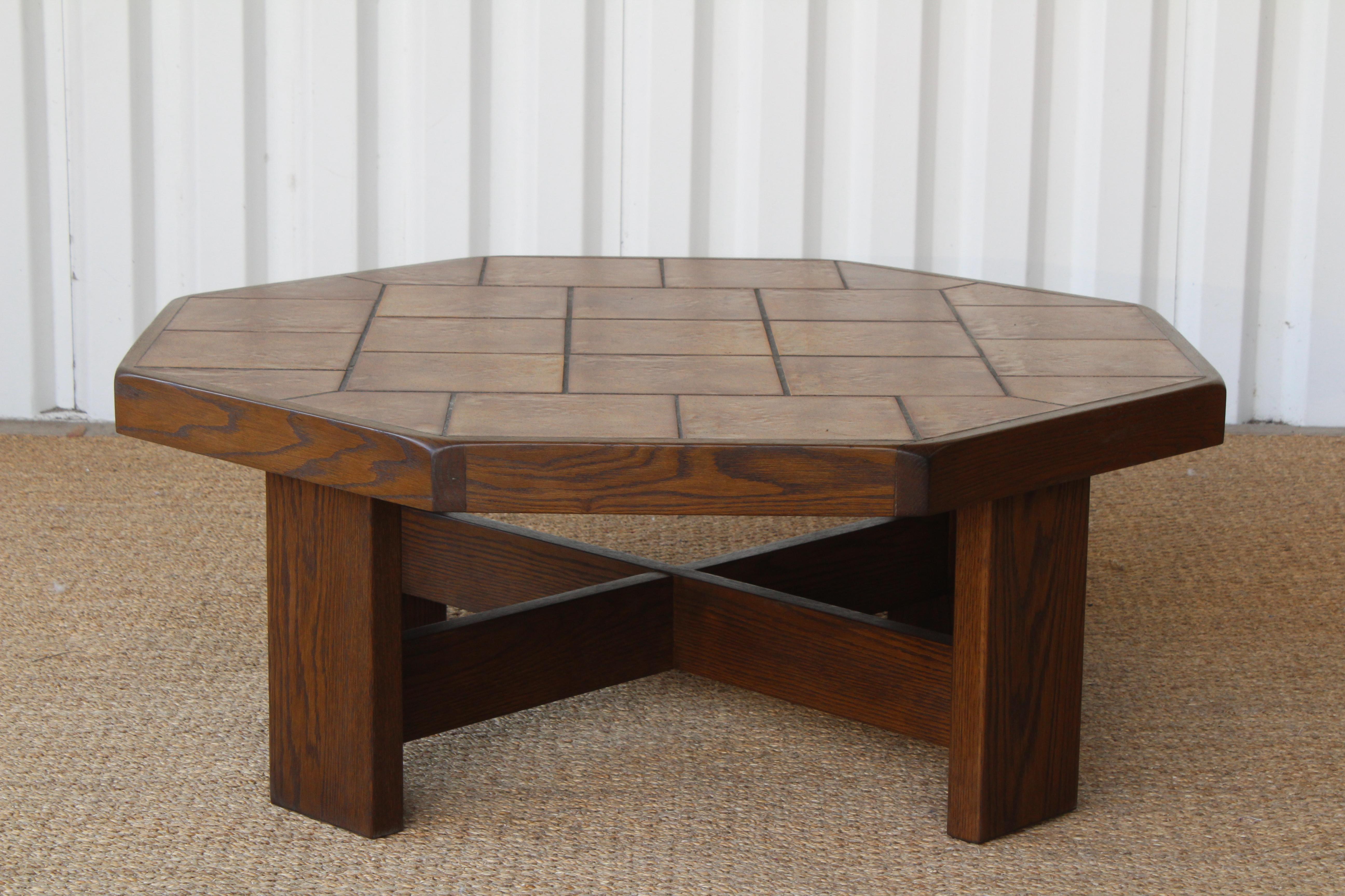 Vintage oak and ceramic tile top coffee table, France, 1970s. The oak base and frame have been refinished. Original ceramic tile top is in excellent condition. Unknown maker and designer.