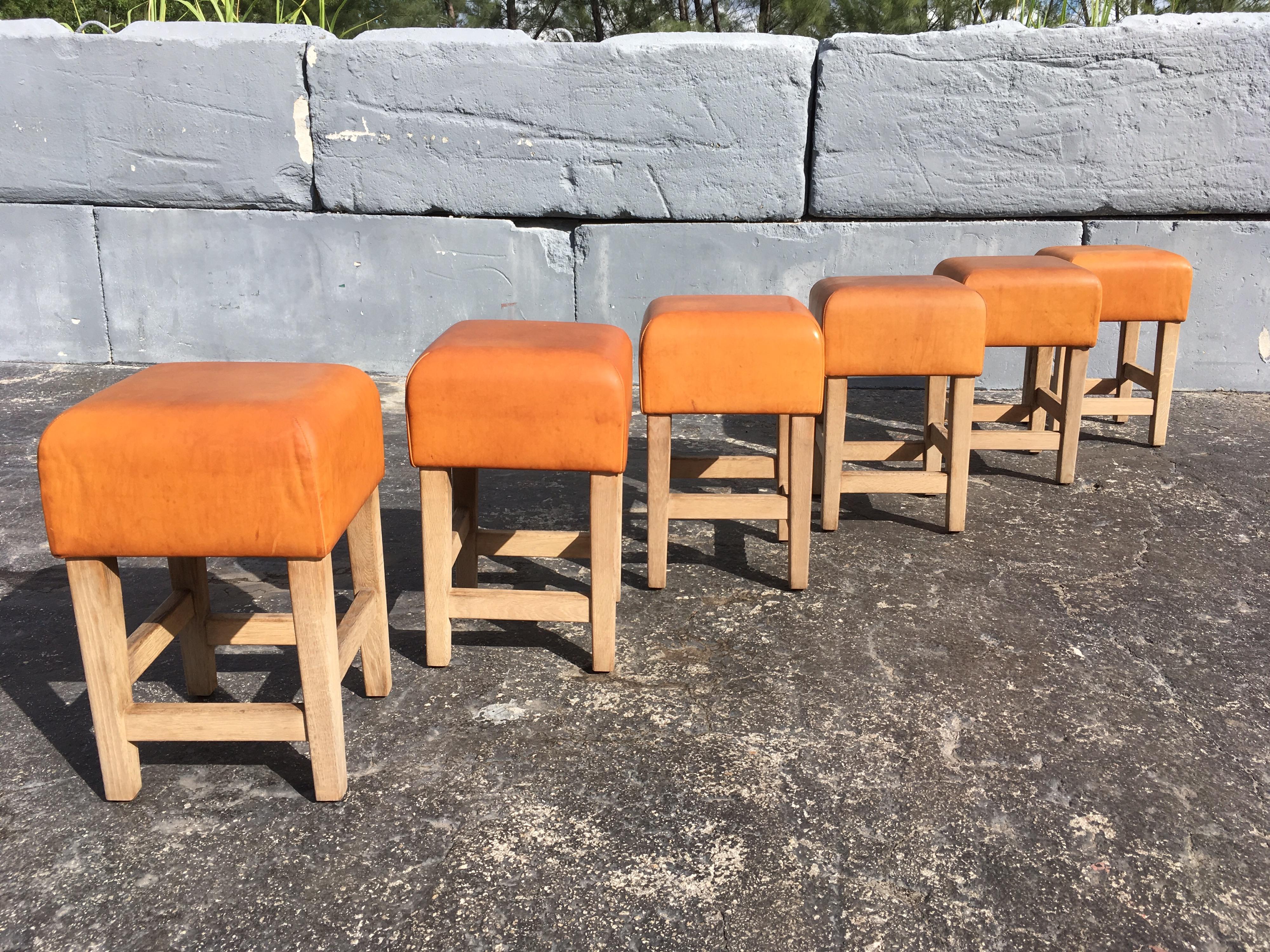 Beautiful and extremely well made stools or chairs, solid oak and beautiful cognac leather with a great patina.
The leather is very thick and the oak construction will last forever.