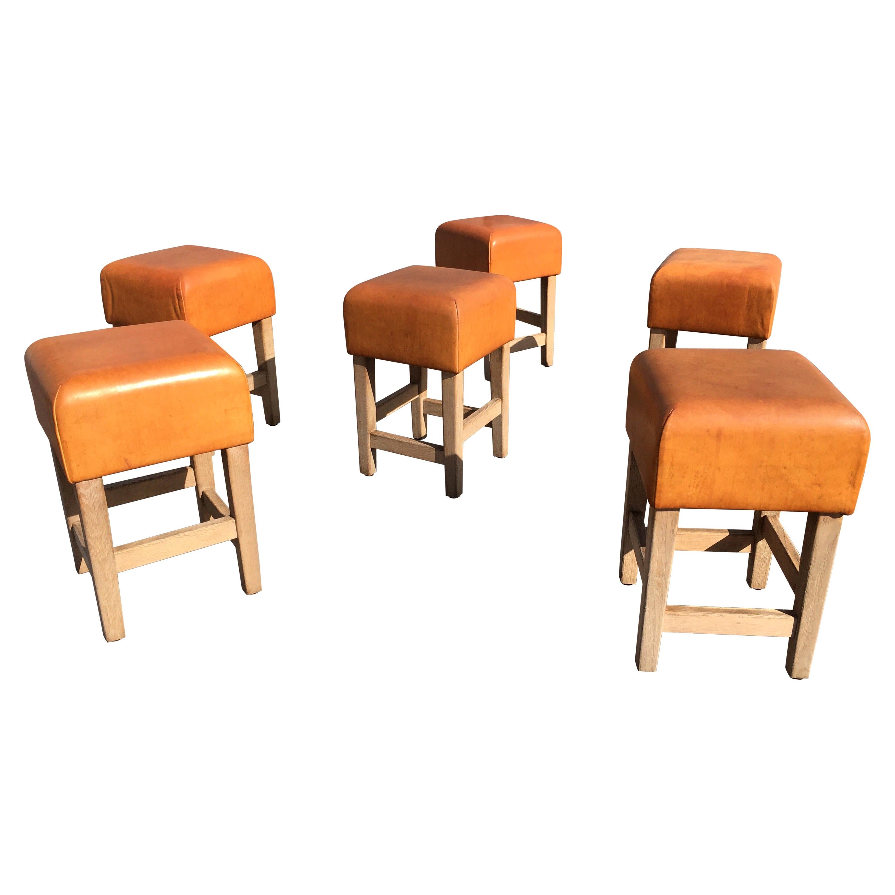 Beautiful and extremely well made stools or chairs, solid oak and beautiful cognac leather with a great patina.
The leather is very thick and the oak construction will last forever.