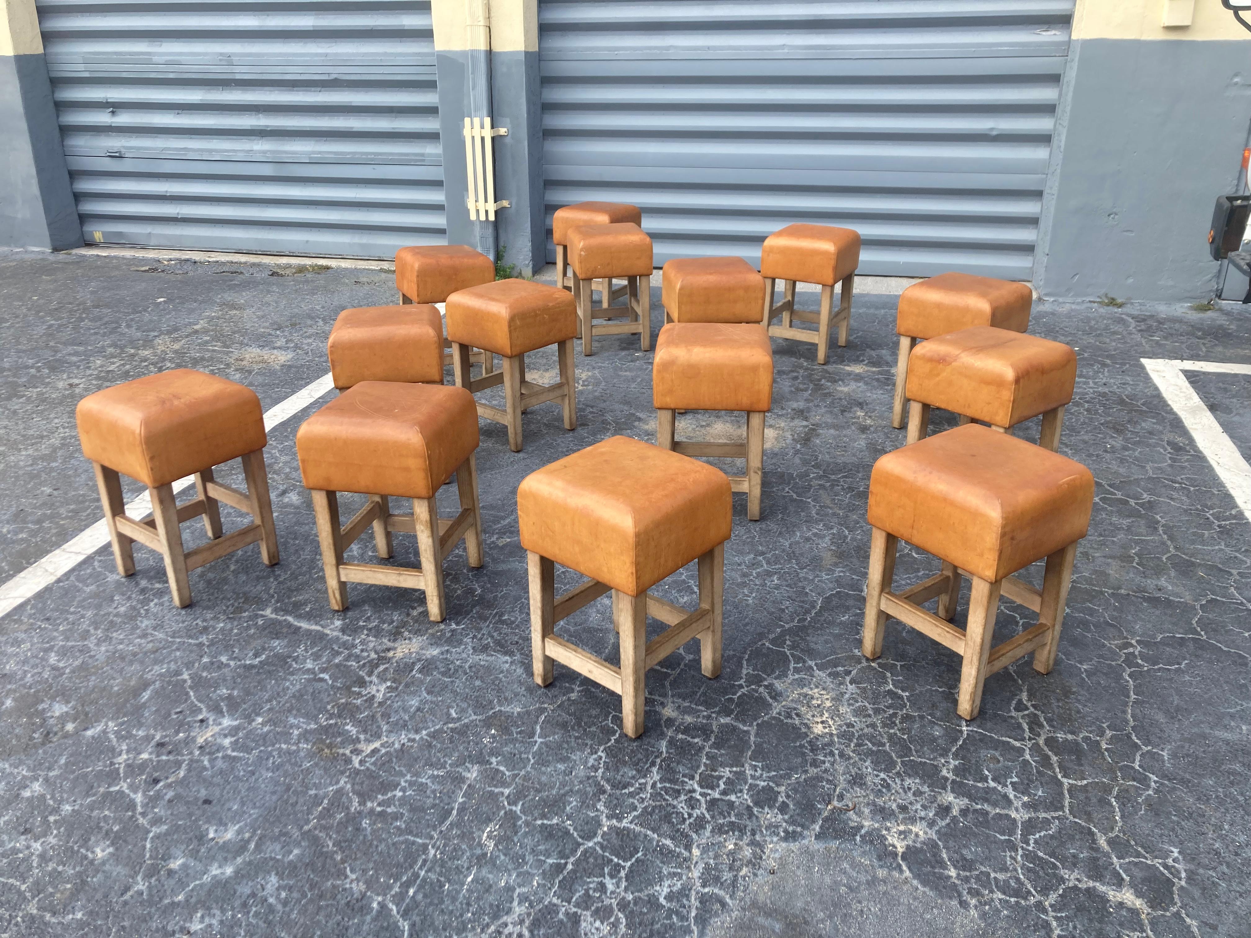 Beautiful and extremely well made stools or chairs, solid oak and beautiful cognac leather. The leather has a strong patina, scratches, nicks and spots. Please see all pictures.
The leather is very thick and the oak construction will last forever.