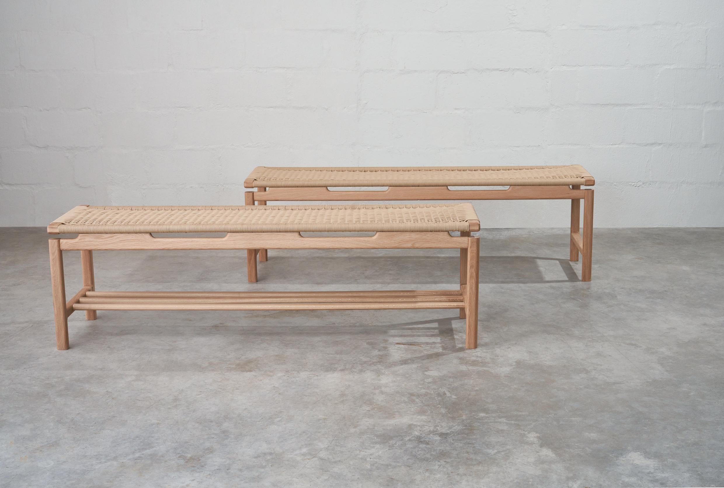 The woven bench has an intricate, detailed design, with beautifully rounded corners and exposed joinery. Made from solid white oak and hand woven the bench has a perfect balance between simplicity and craftsmanship.This versatile piece of furniture