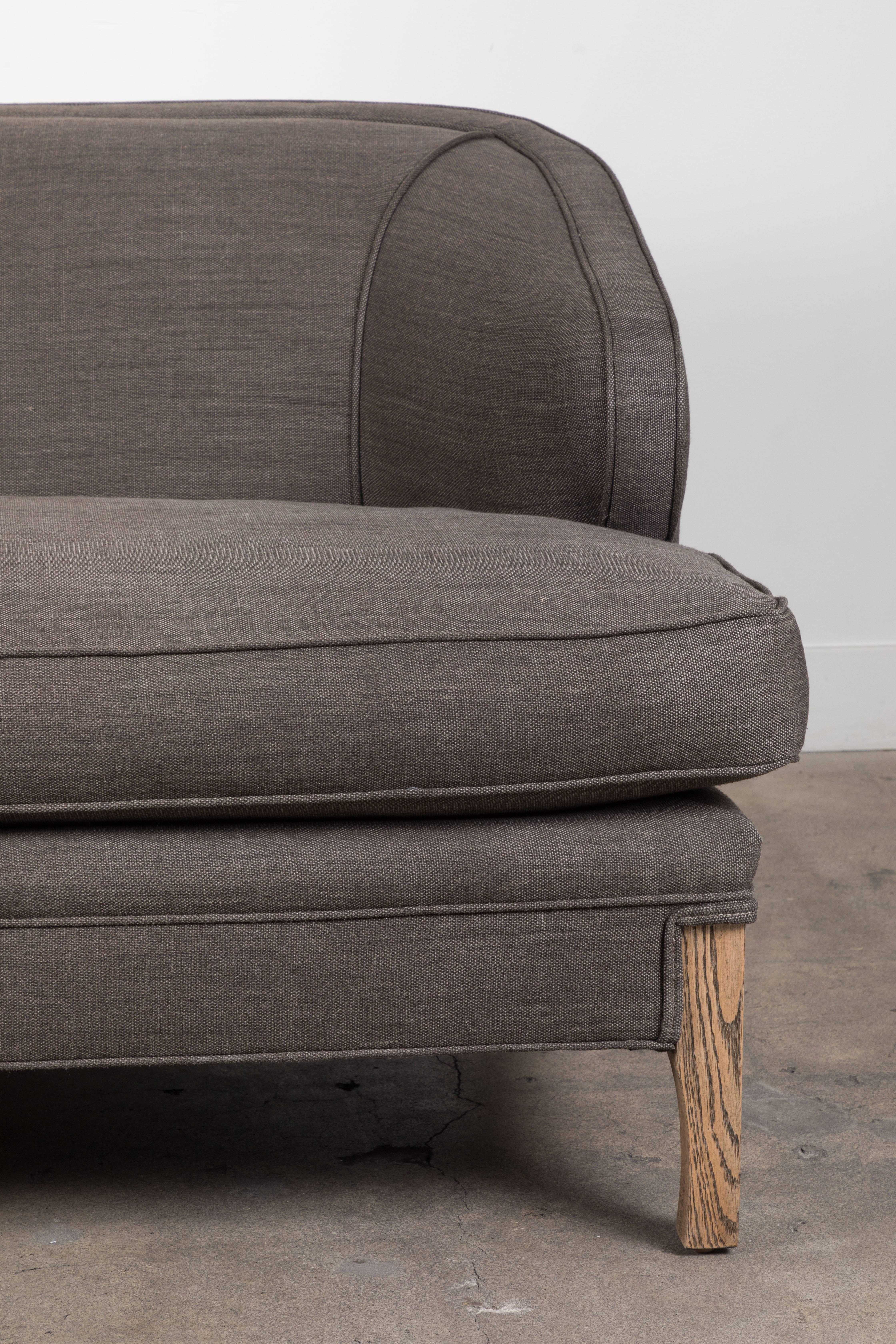 The Douglas sofa is a low slung sofa with a down-wrapped seat cushion and solid American walnut or white oak legs. 

The Lawson-Fenning Collection is designed and handmade in Los Angeles, California.

