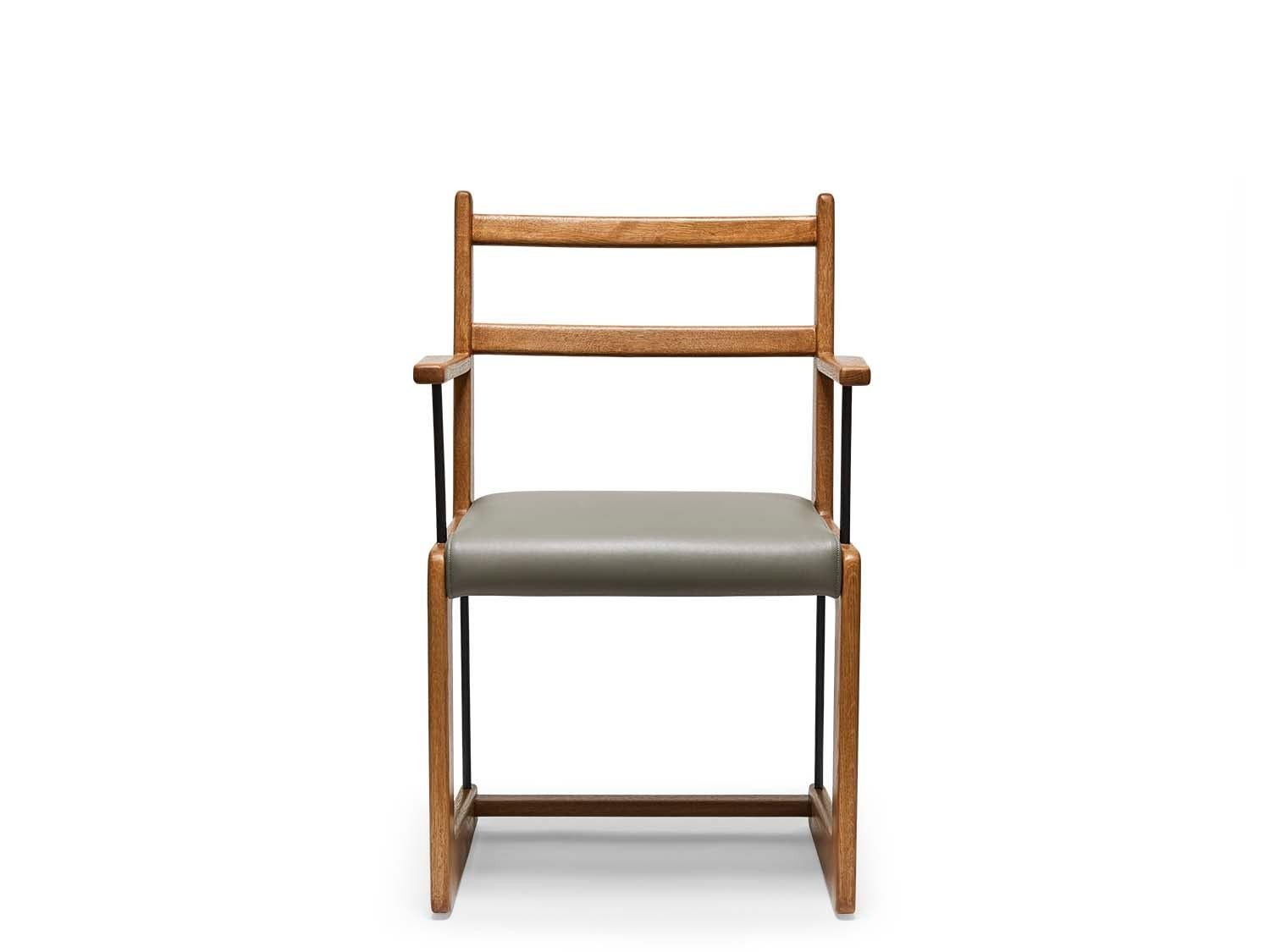 The Cruz dining chair is made from a solid American walnut or white oak frame that features a cantilevered shape and lacquered brass stretchers. The seat is upholstered. Shown here in Oiled Oak.

The Lawson-Fenning Collection is designed and
