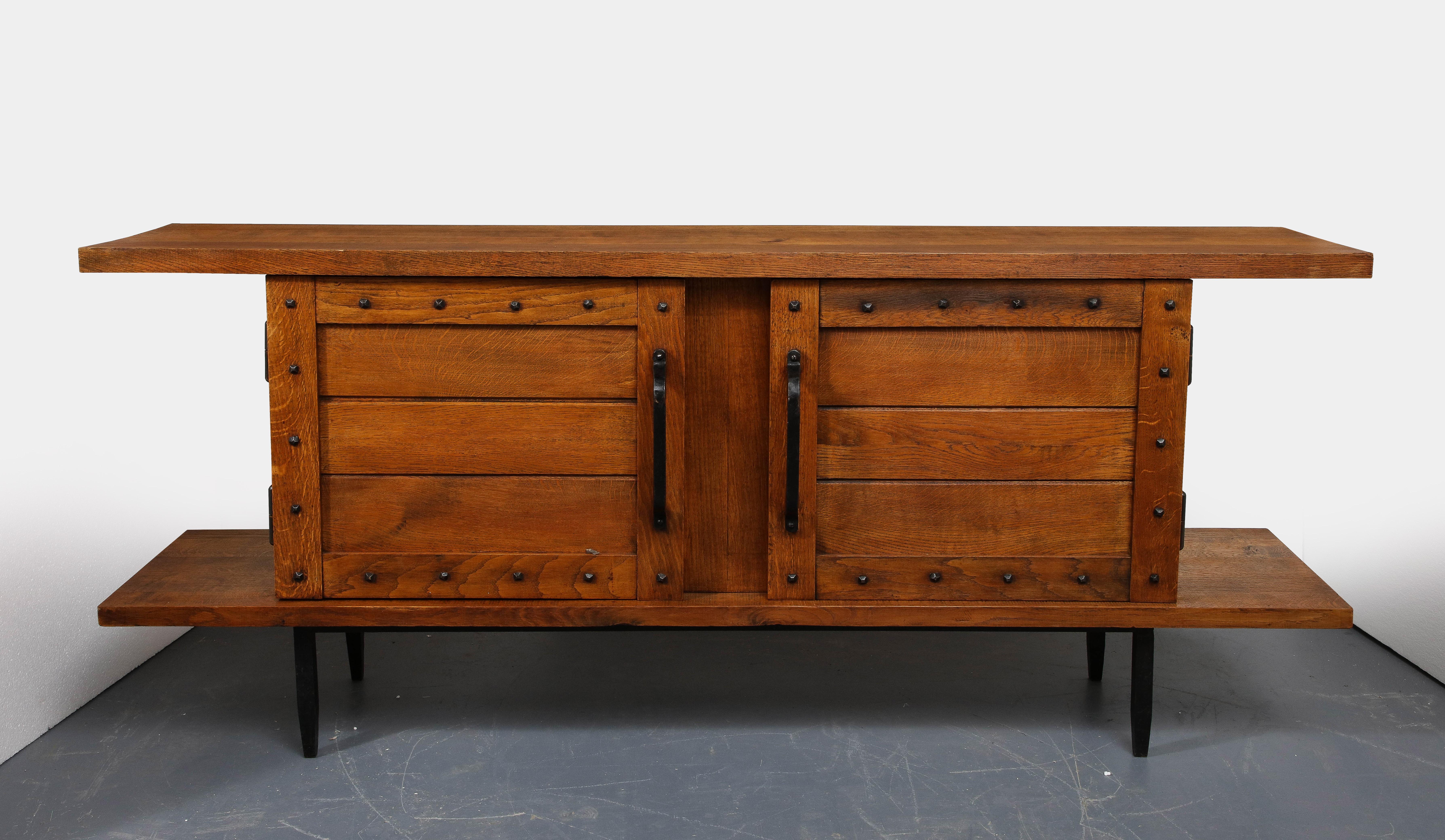 Oak and Iron Sideboard by the Artisans of Les Marolles, France, mid-20th century.

Both rustic and minimalist in design, this fantastic sideboard exhibits all of the mainstays of work produced by the Artistans of Les Marolles: solid oak