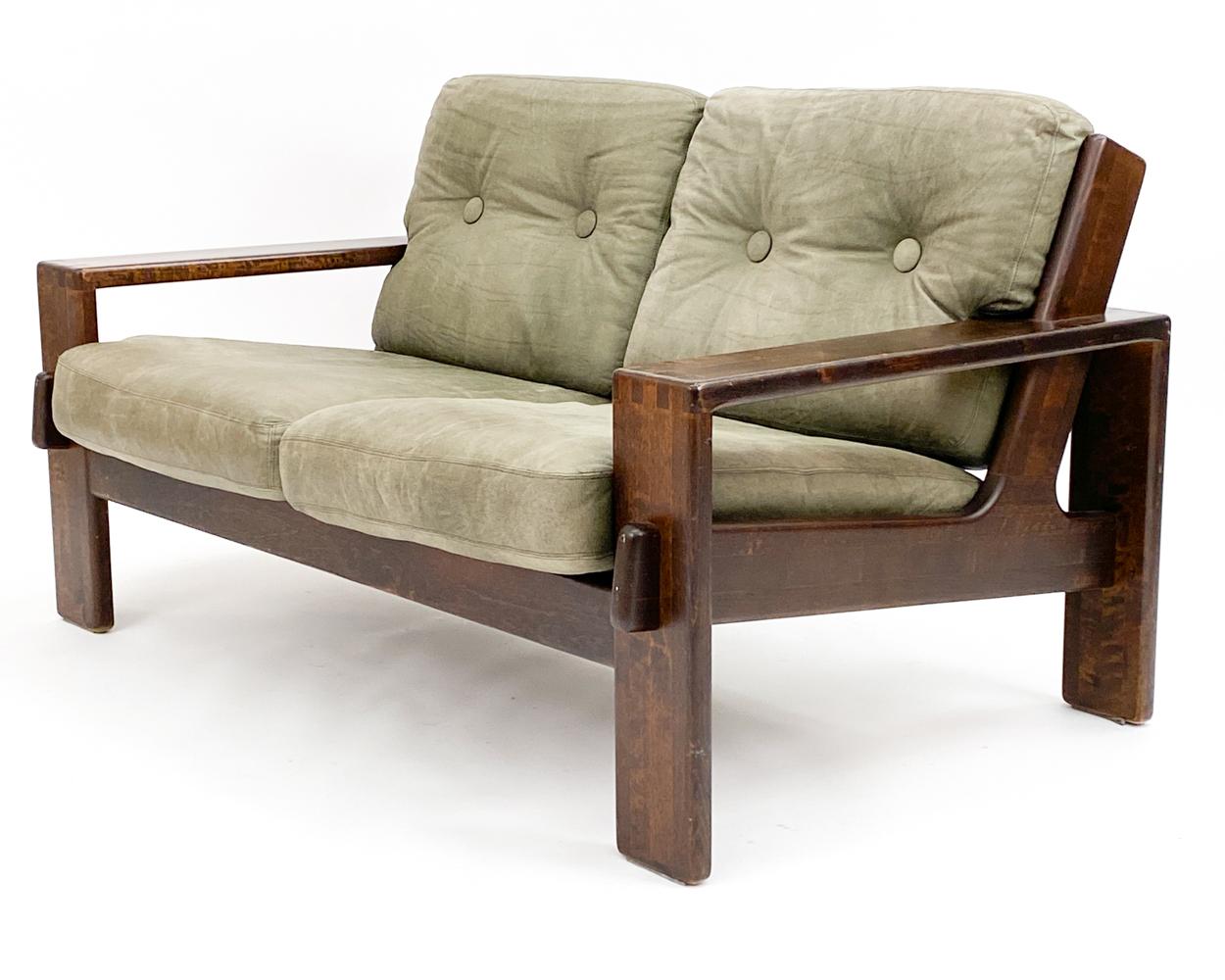 This tasteful two-seat brutalist sofa was designed by Esko Pajamies for the Finnish manufacturer Asko, most likely in the 1970's. As a part of the 'Bonanca' collection, this piece stands out as an iconic piece in Pajamies' usual style of playful and