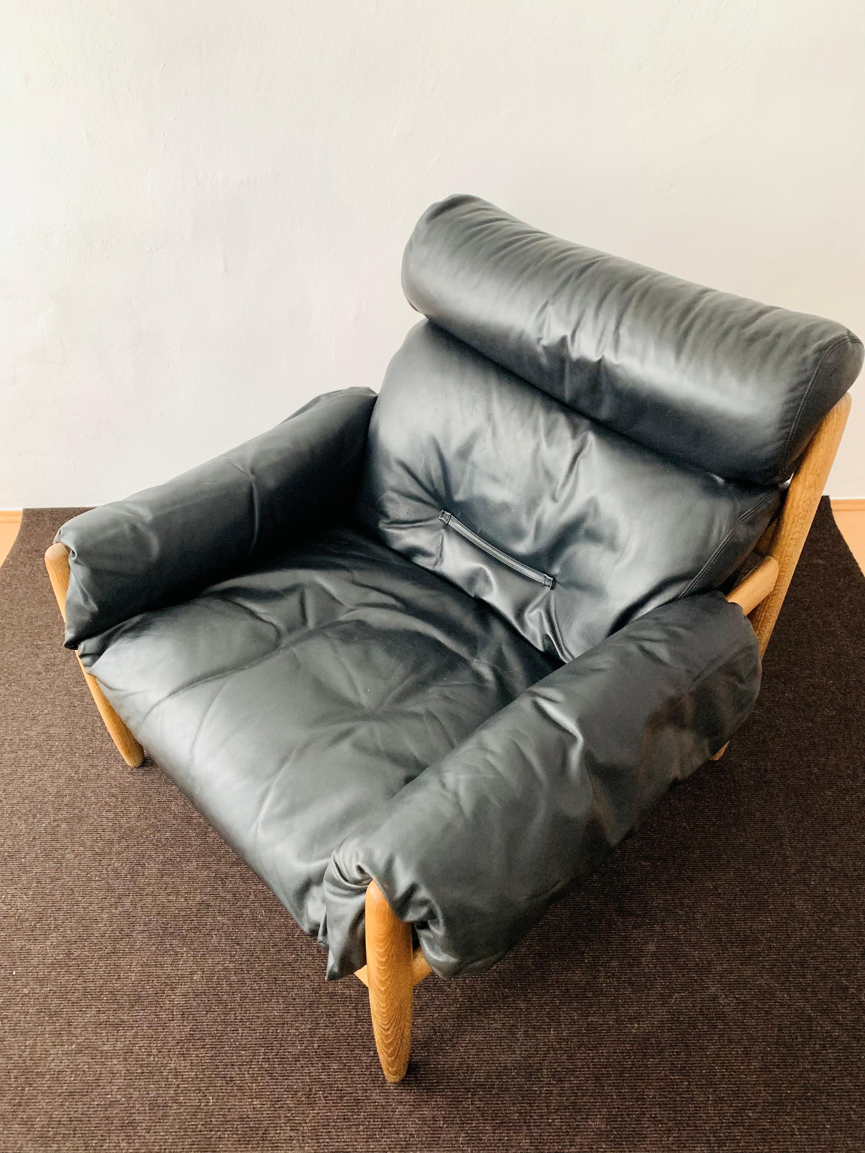 Oak and leather lounge chair with ottoman For Sale 3