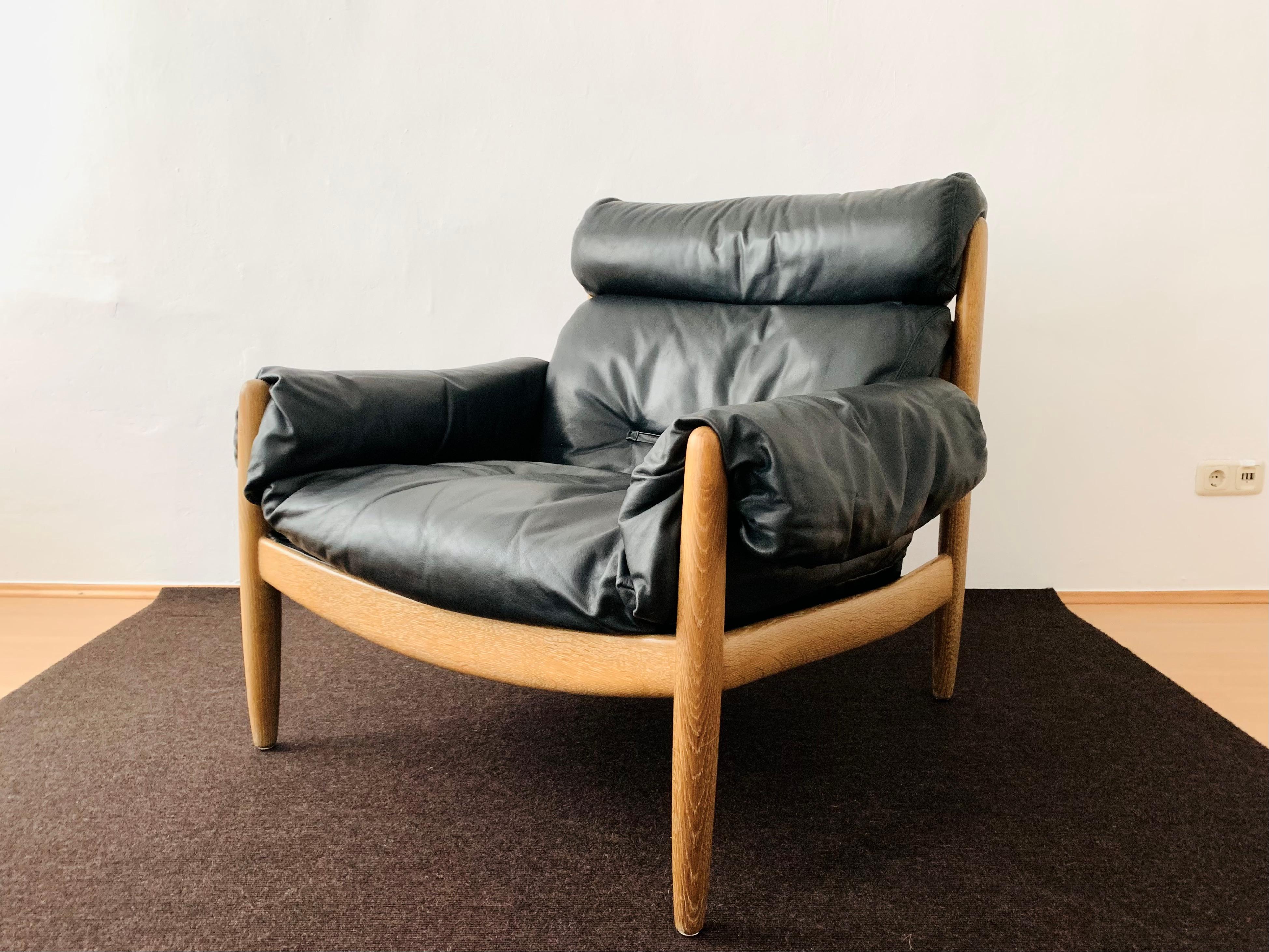 Oak and leather lounge chair with ottoman For Sale 1