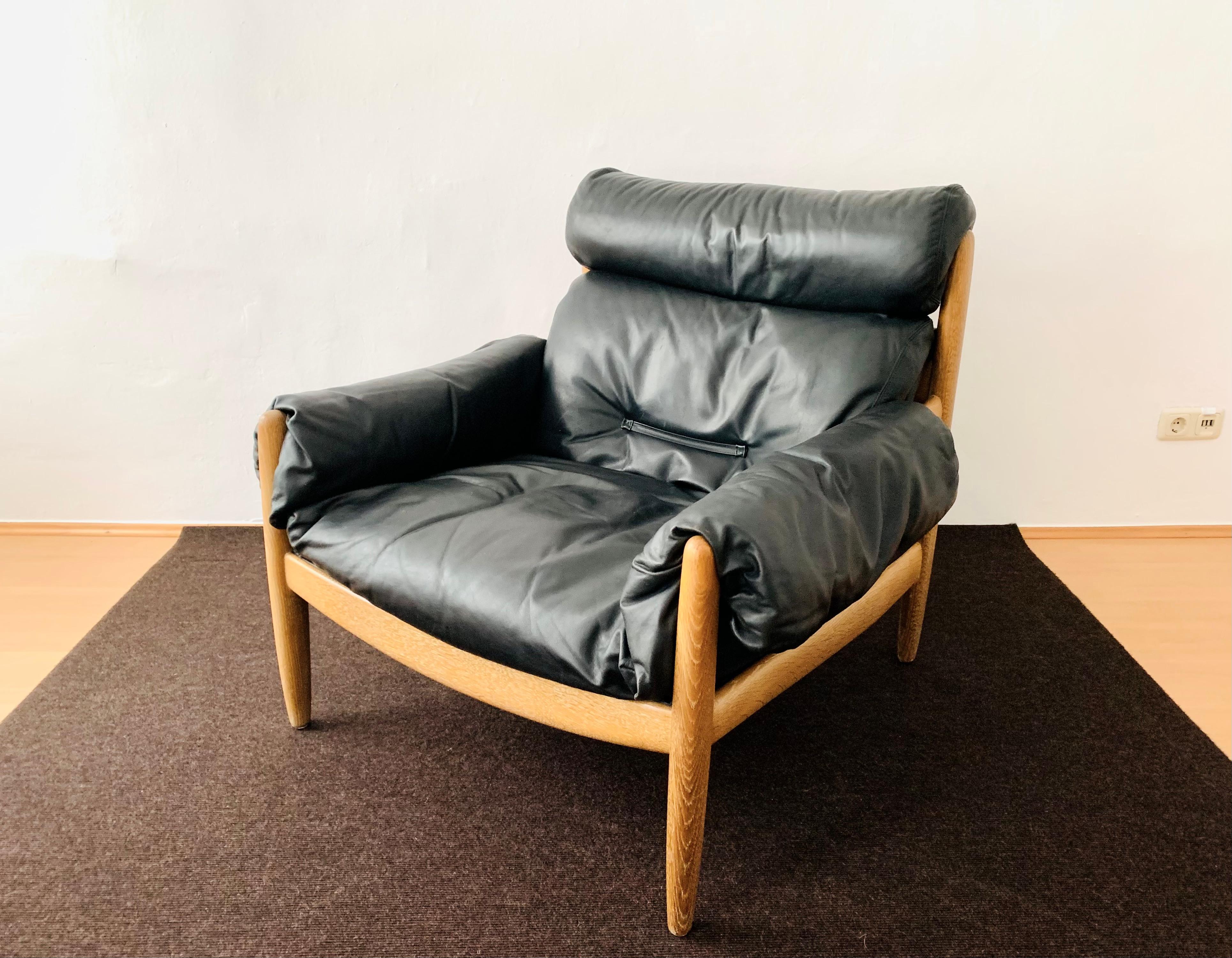 Oak and leather lounge chair with ottoman For Sale 2