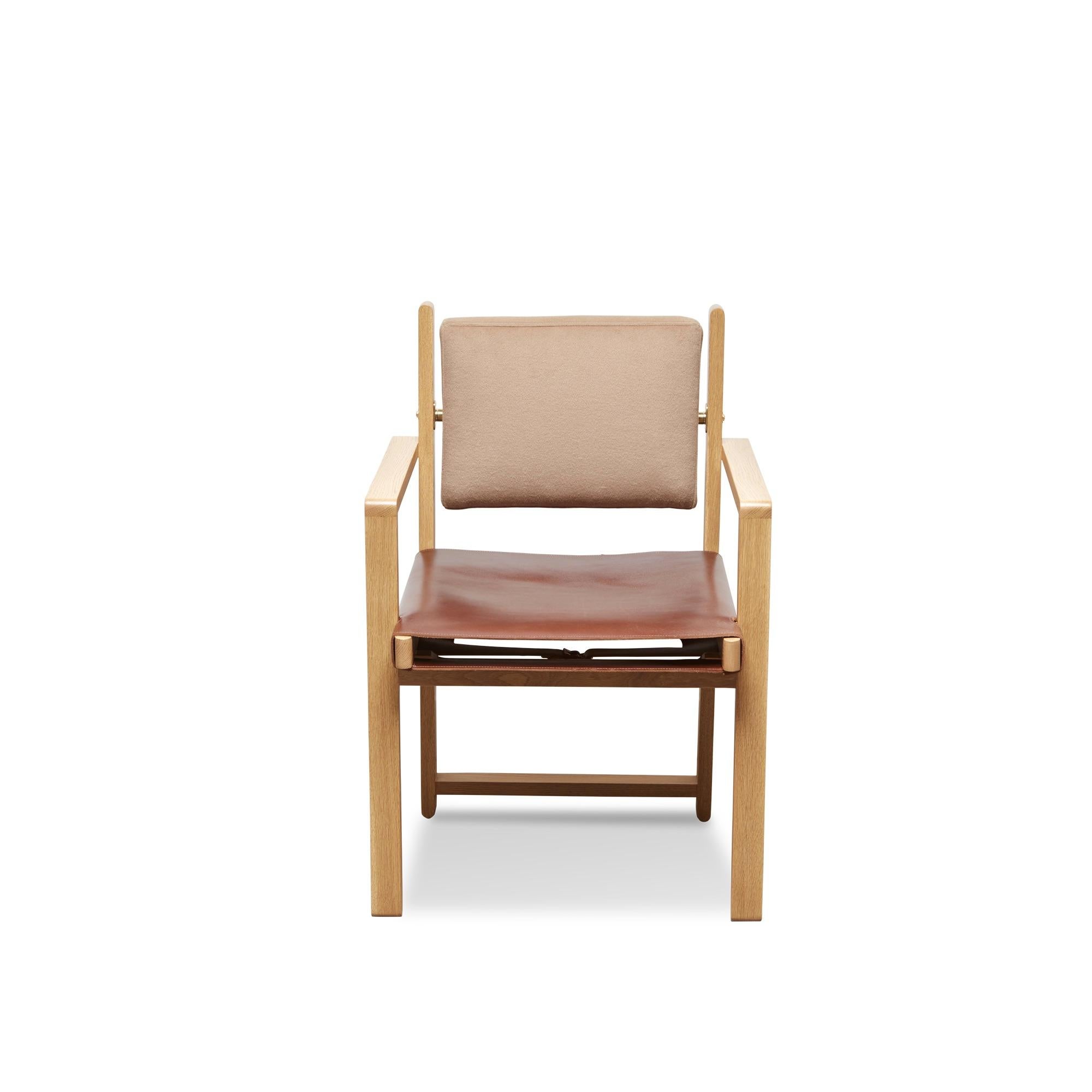 The Morro dining chair is made from a solid American walnut or white oak frame and features an upholstered back cushion and a leather sling seat. An optional loose seat cushion is also available.

The Lawson-Fenning Collection is designed and