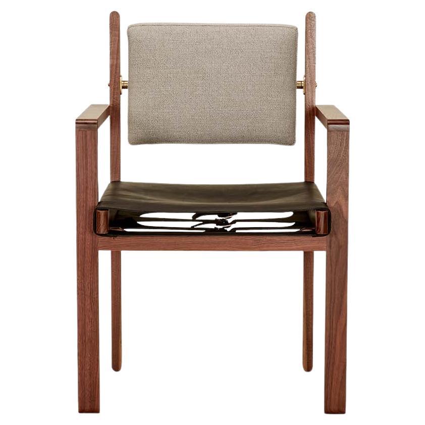 The Morro dining chair is made from a solid American walnut or white oak frame and features an upholstered back cushion and a leather sling seat.

 