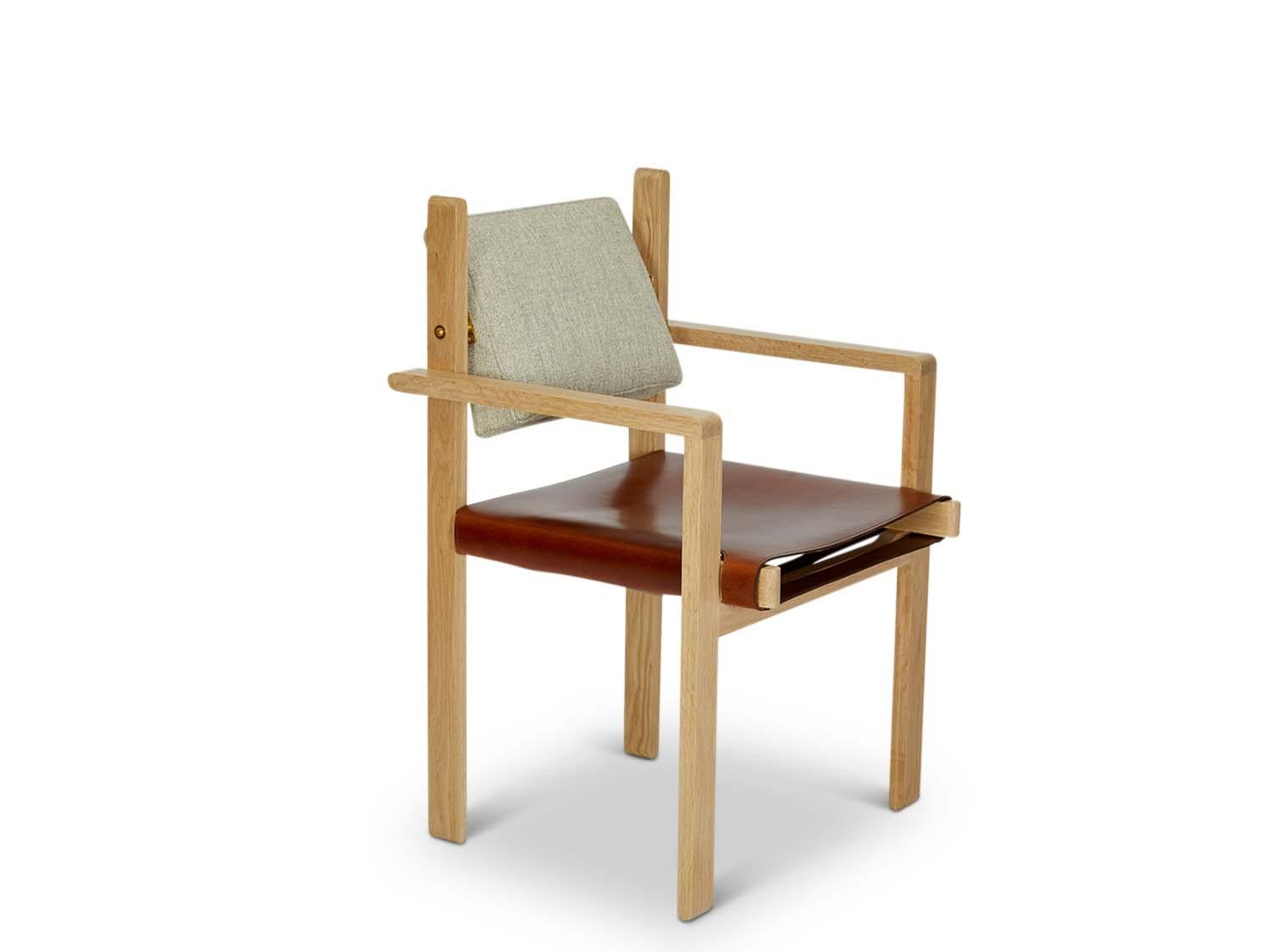 The Morro dining chair is made from a solid American walnut or white oak frame and features an upholstered back cushion and a leather sling seat.

The Lawson-Fenning Collection is designed and handmade in Los Angeles, California. Reach out to